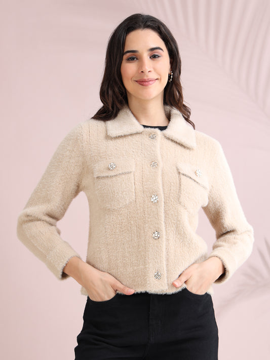 Beige fuzzy button-down jacket for women with long sleeves and flap pockets.