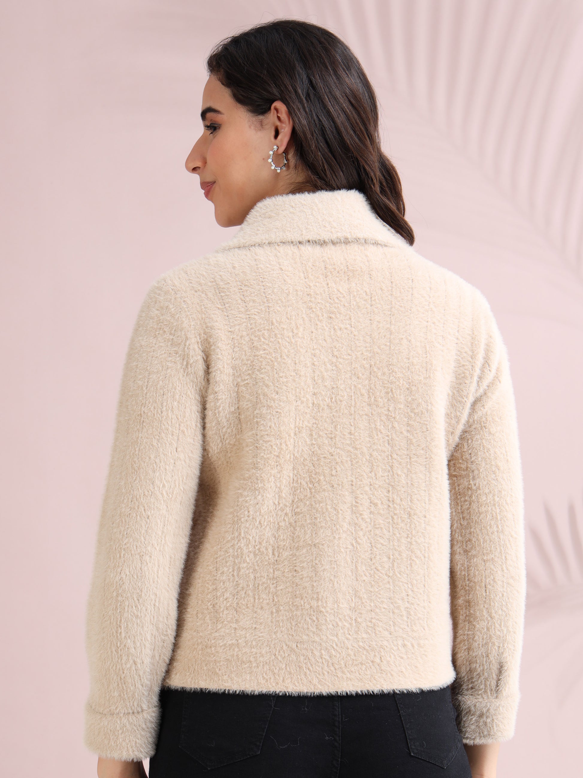 Soft beige faux fur textured women’s jacket with long sleeves, back view.