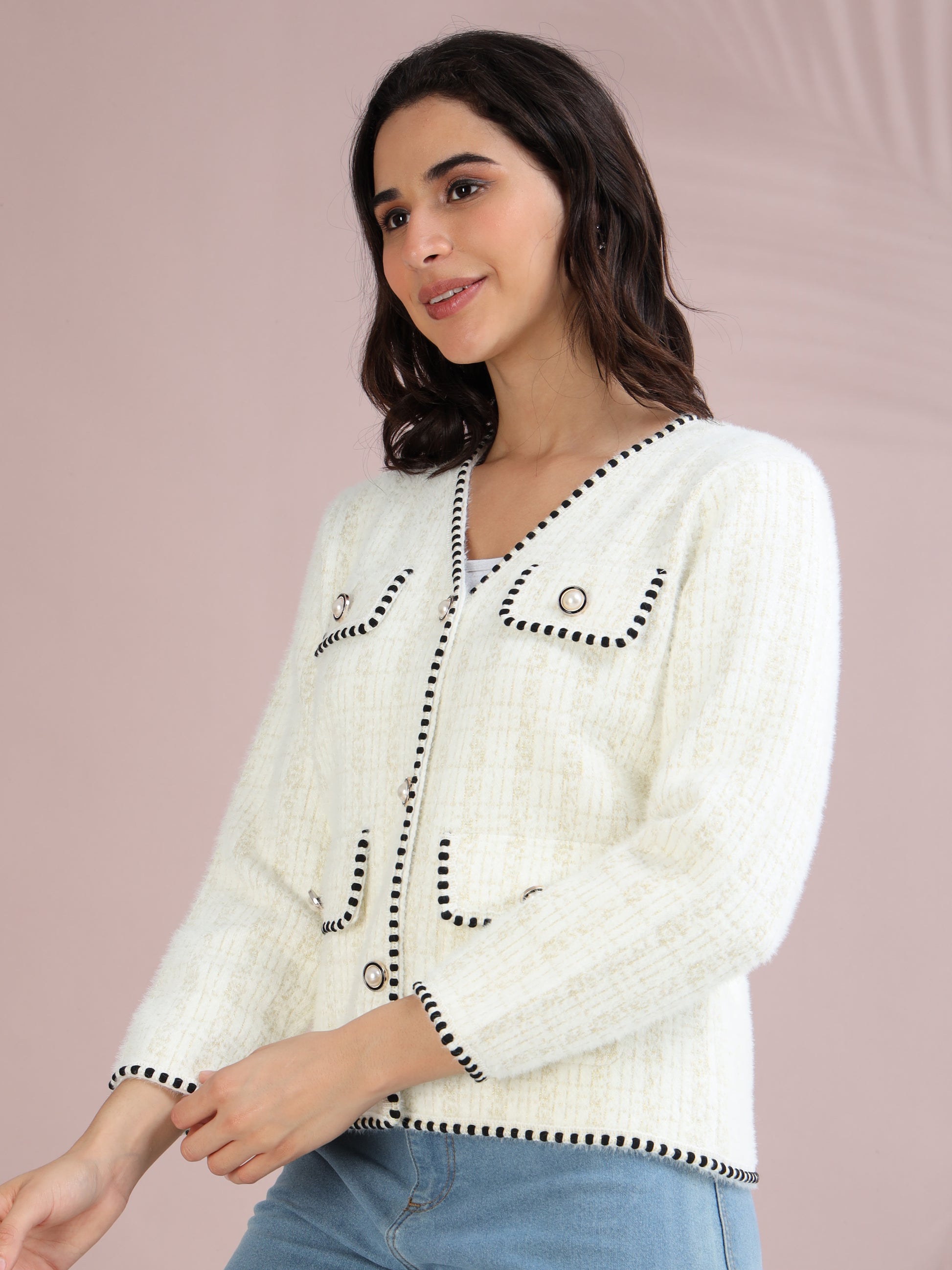 Elegant white cardigan sweater for women featuring contrast black piping and front pocket design.
