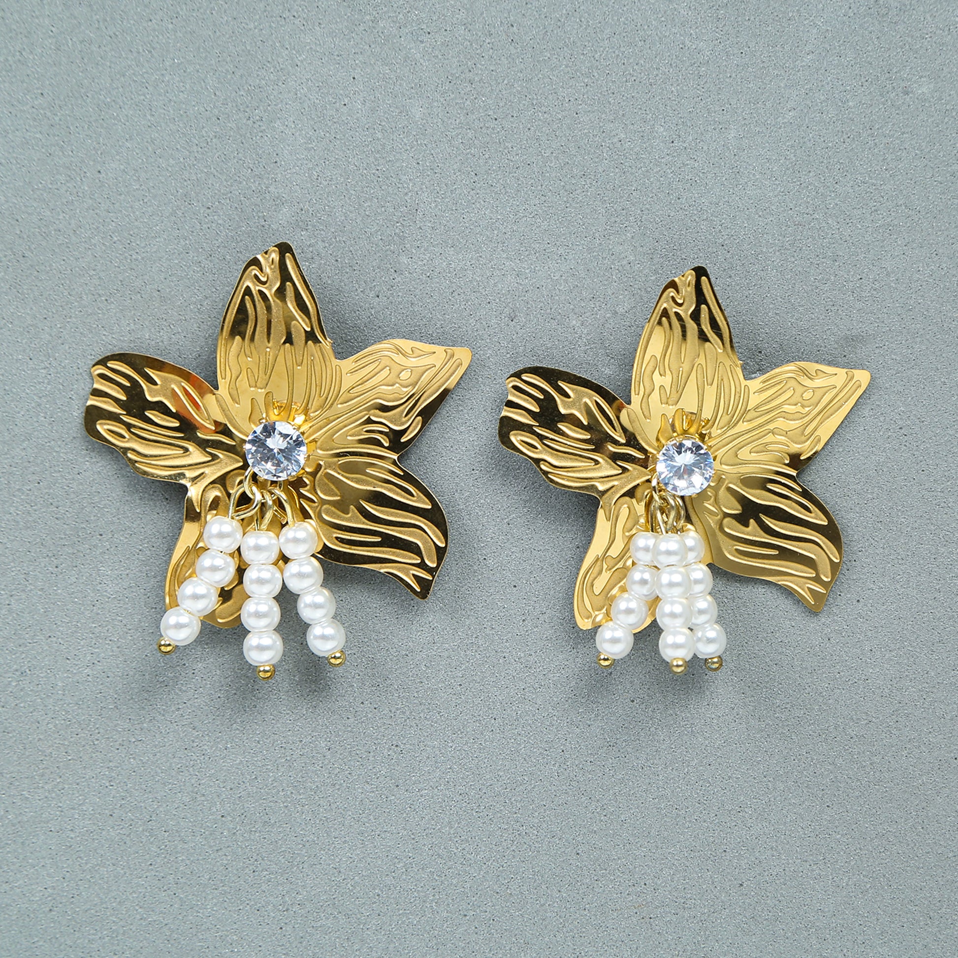 Statement gold floral stud earrings with stone and pearl drops