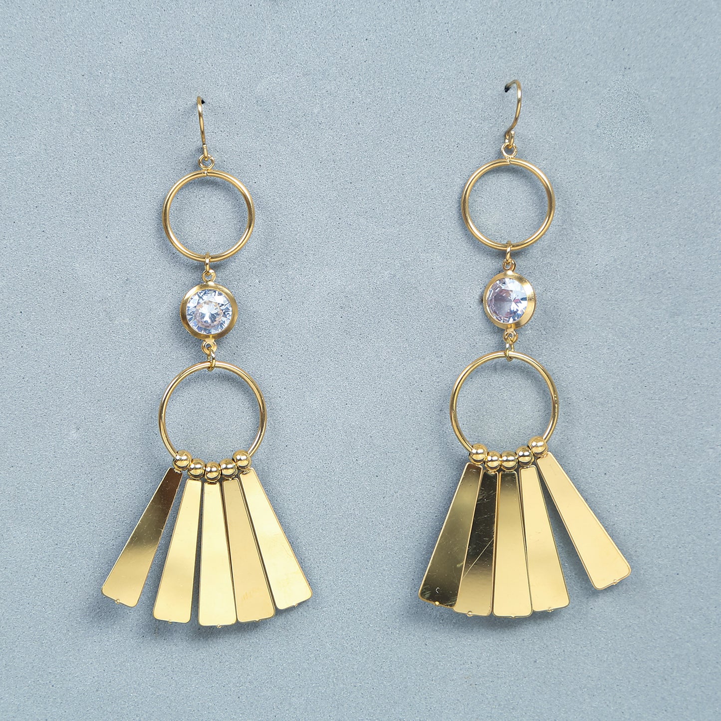 Gold geometric dangle earrings with crystal centerpiece and fan-shaped drop design