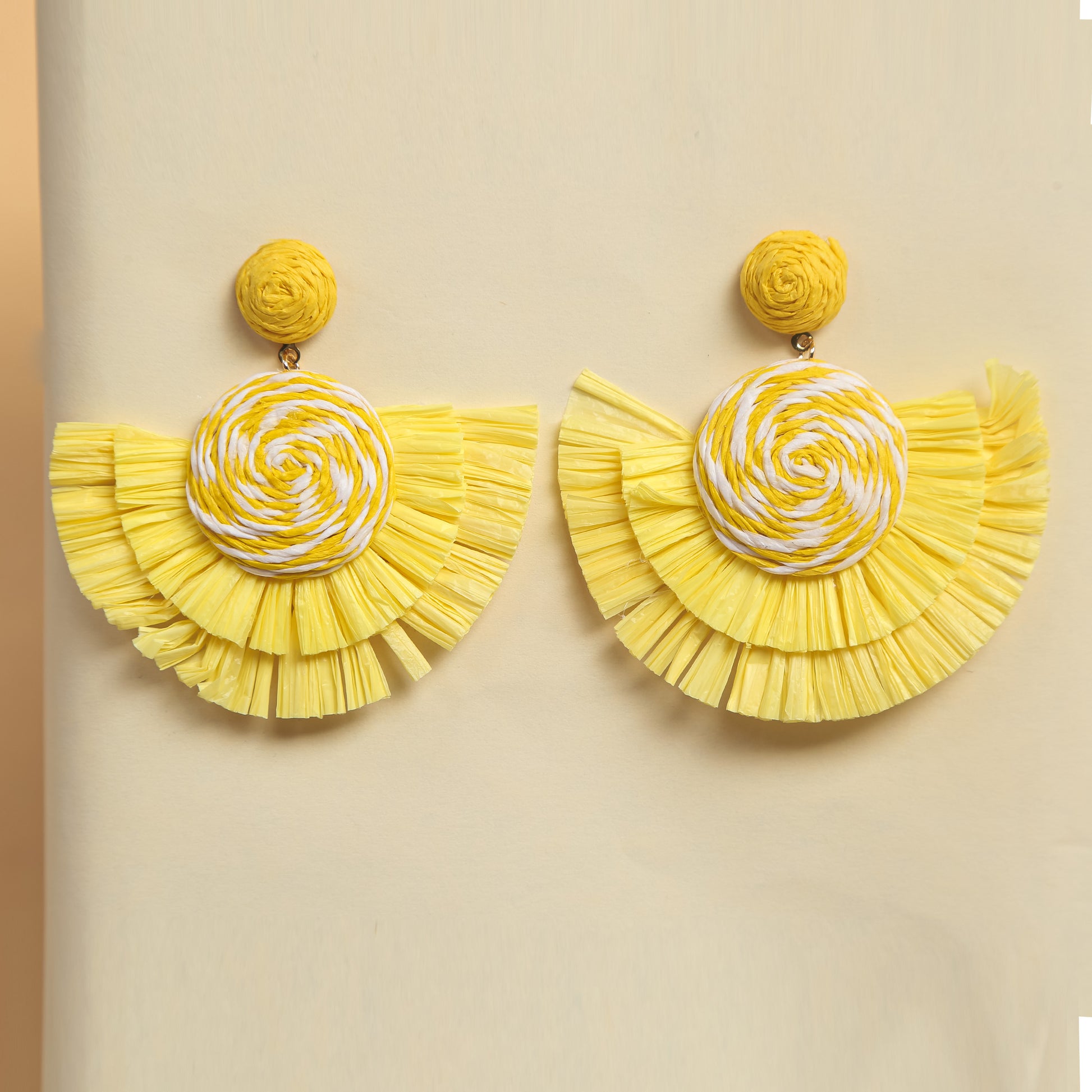 Handmade yellow woven fan earrings with spiral design