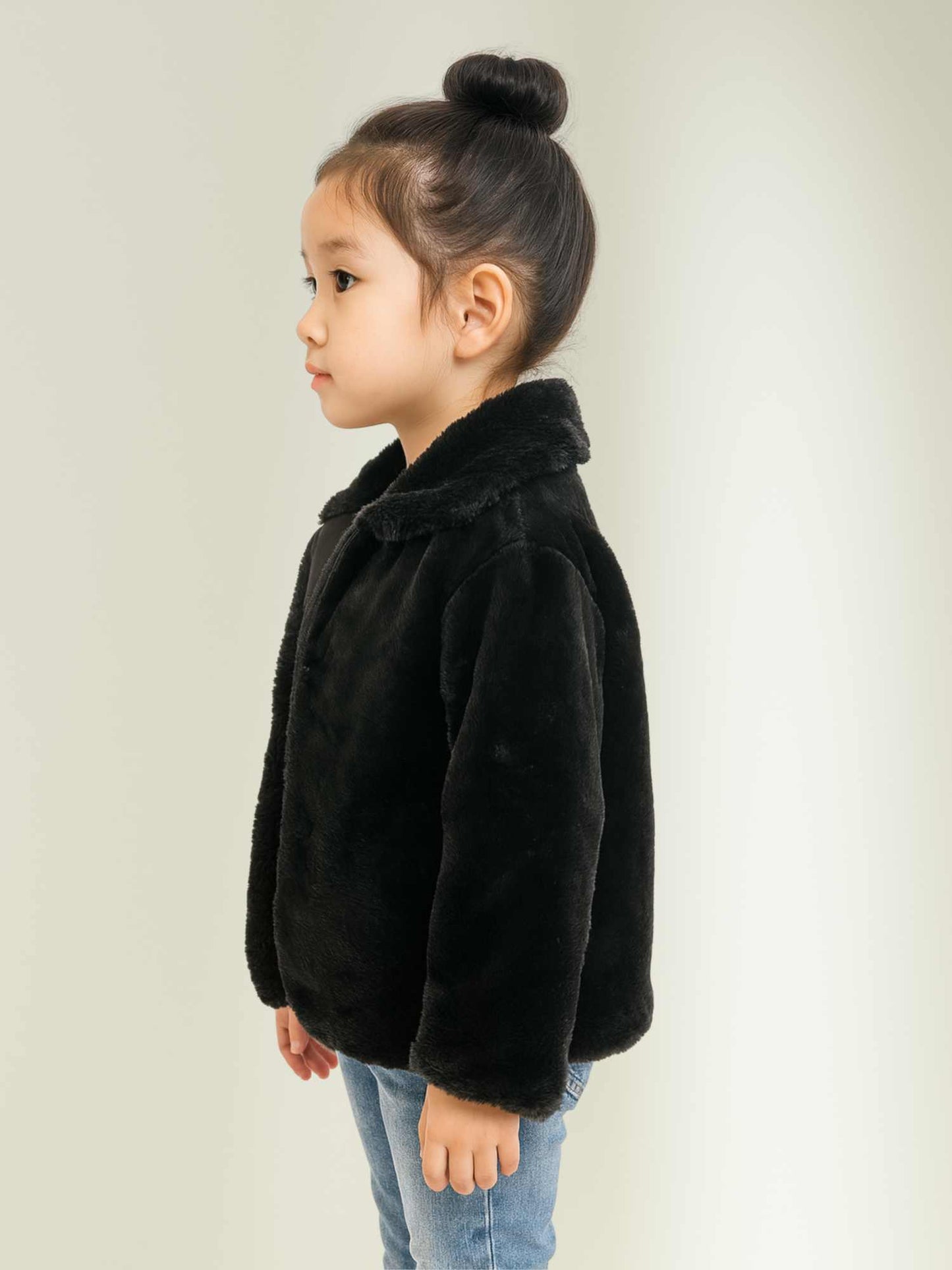 a black faux fur winter jacket by Faryra