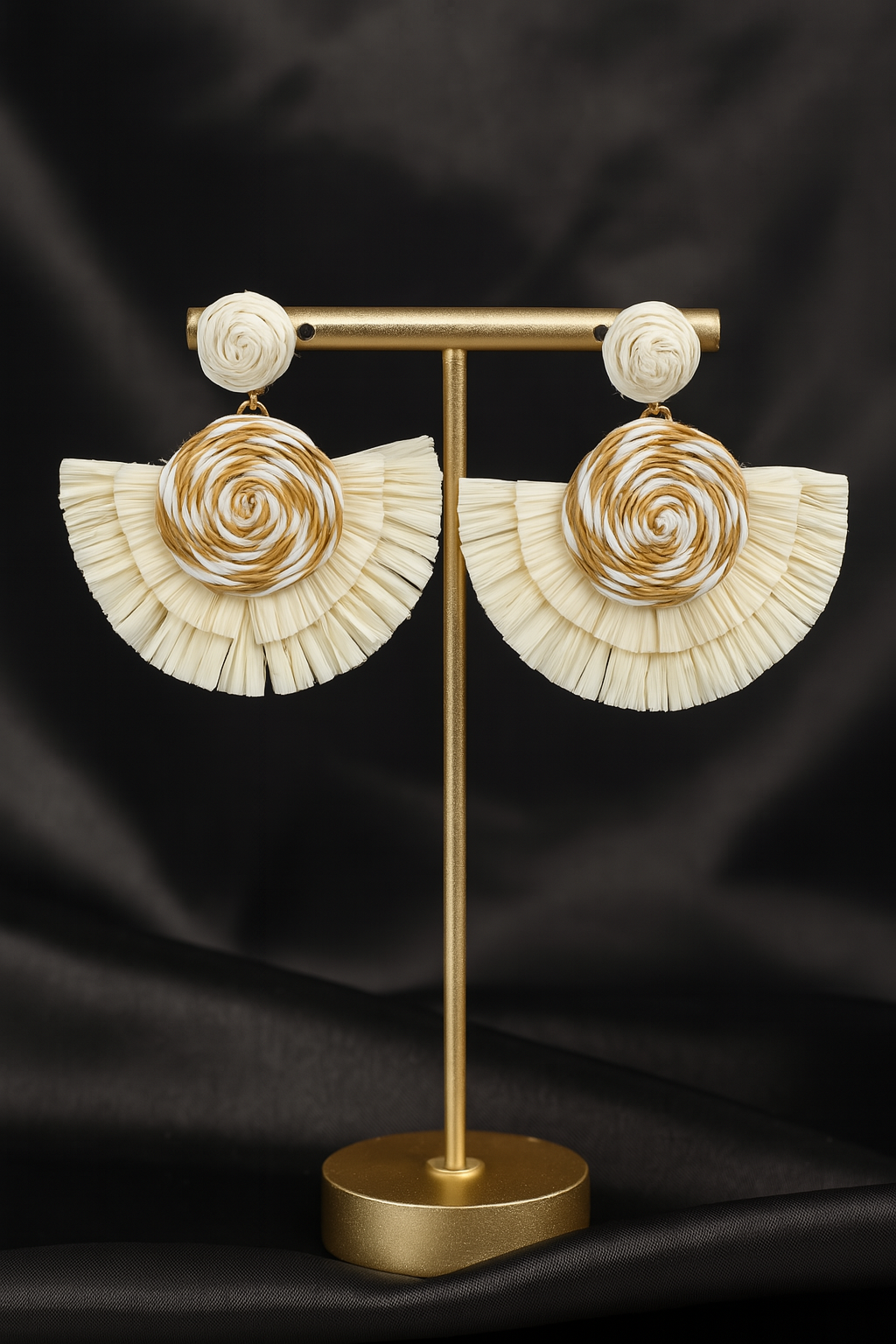 Handmade woven rattan fan earrings with circular swirl design