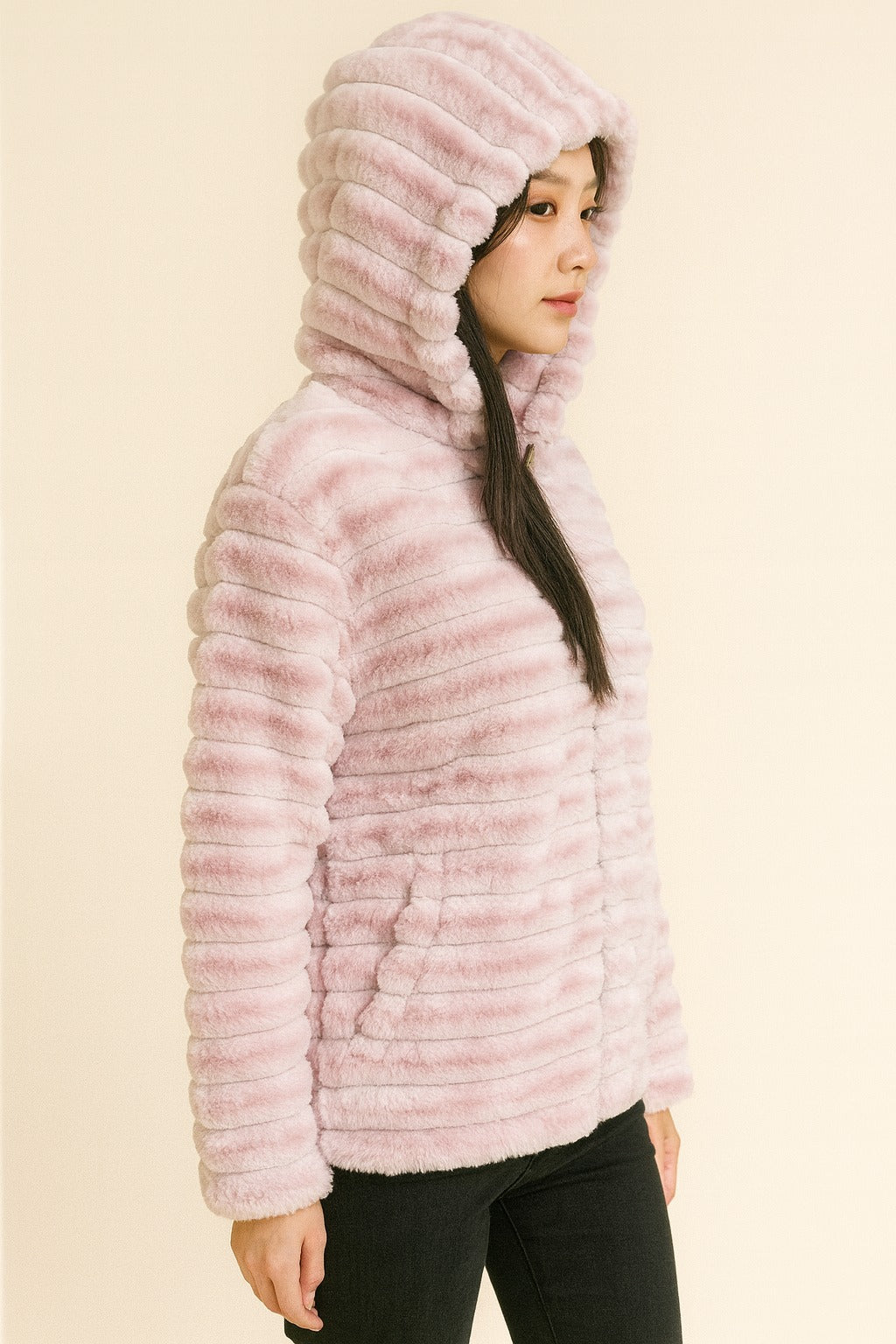 light pink faux fur hooded jacket for women, ribbed plush detailing, warm winter coat design.