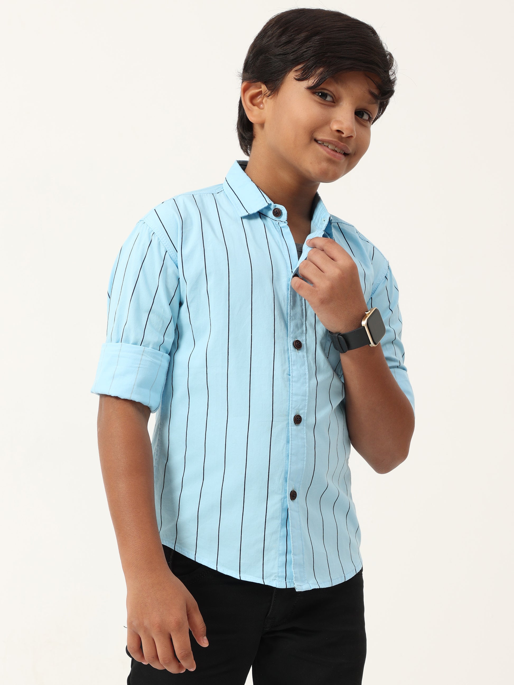 Young boy wearing a light blue striped shirt on a white background
