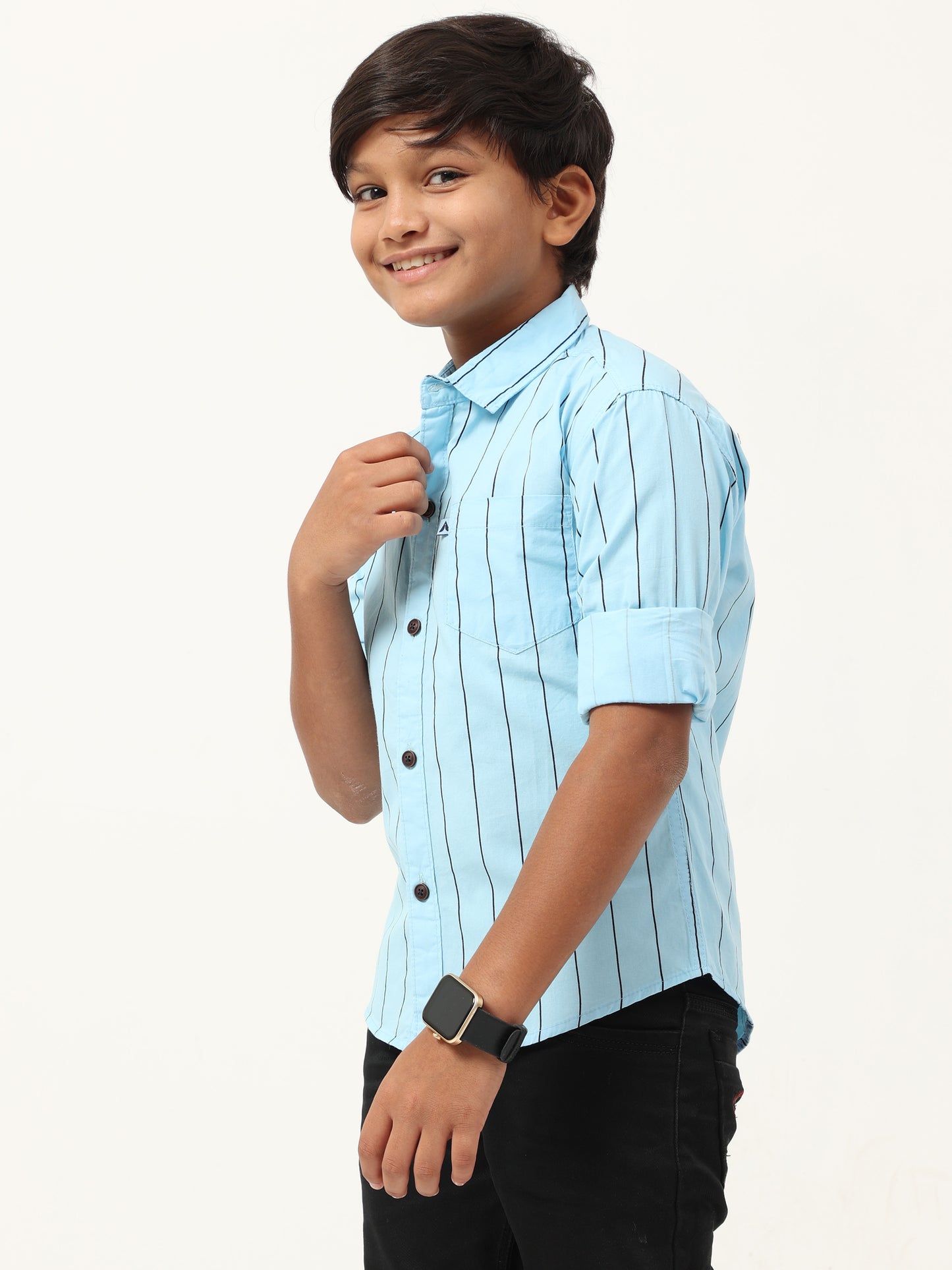 Young boy wearing a light blue striped shirt on a white background