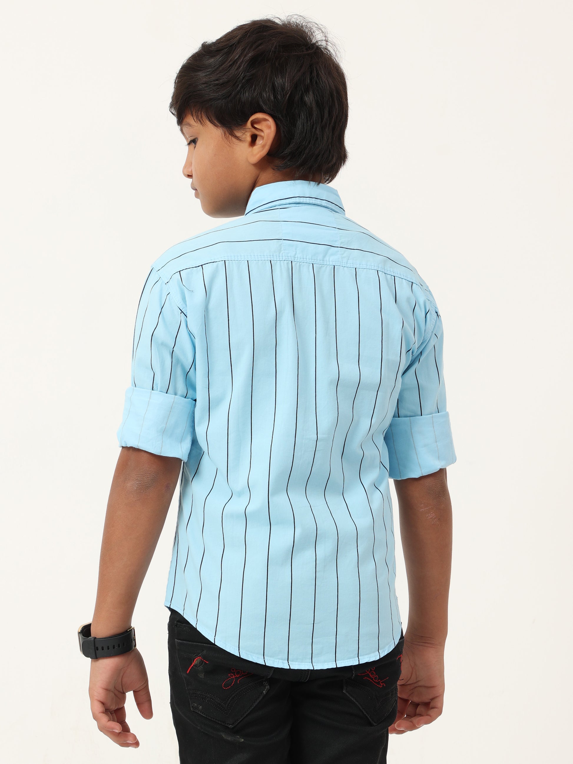Child wearing a light blue striped shirt on a white background