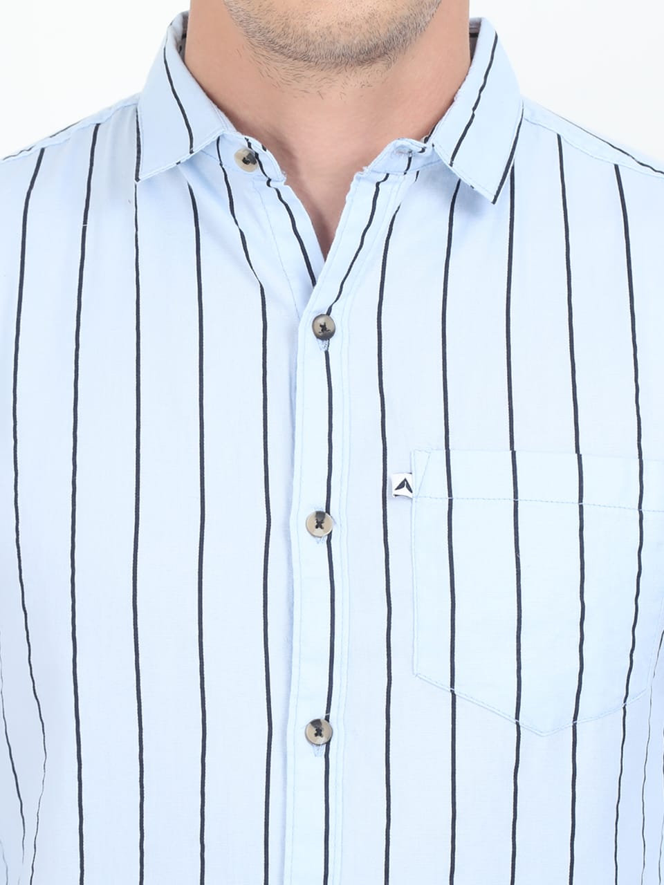 Light blue shirt with black vertical stripes worn by a person