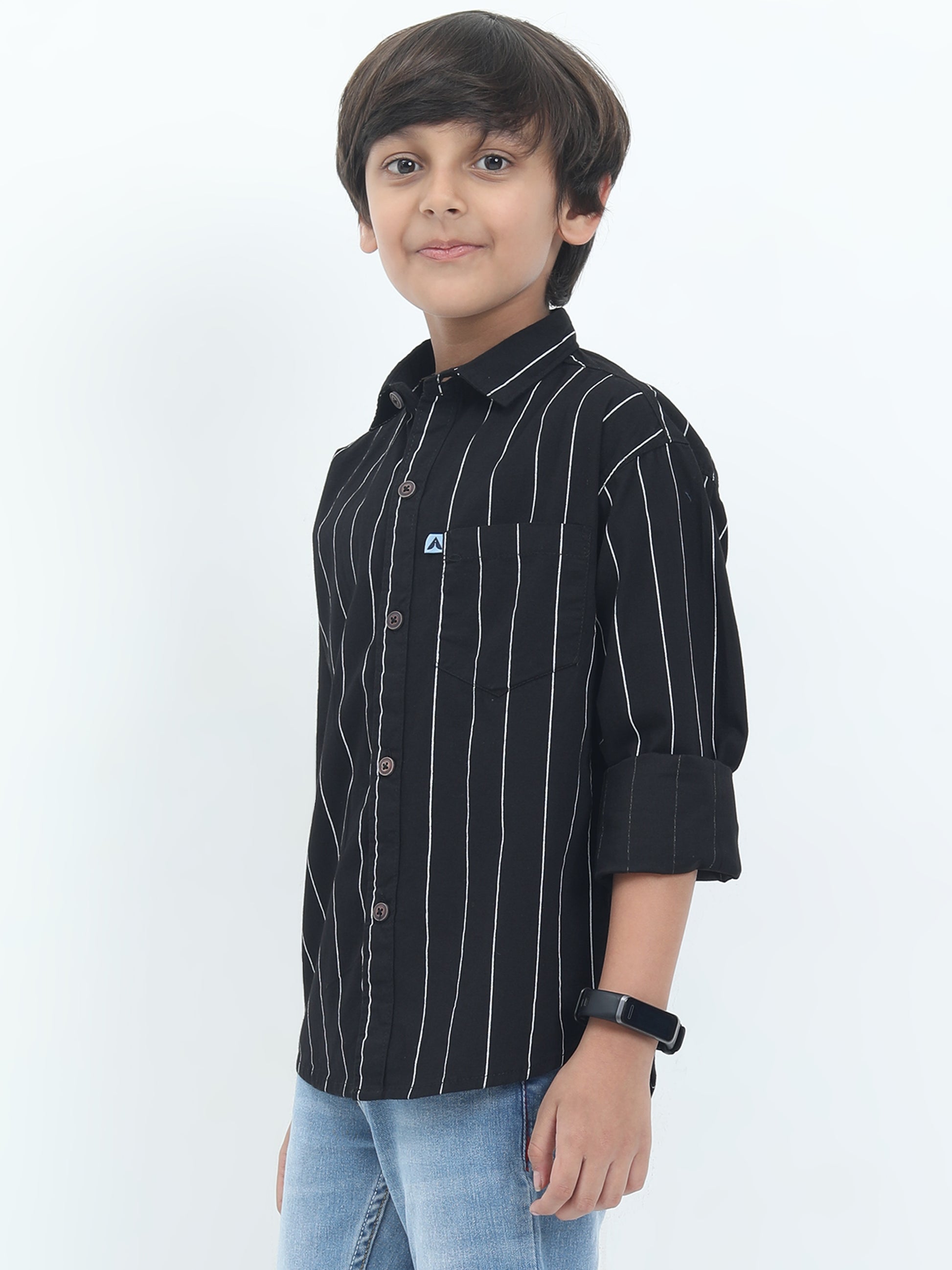 Child wearing a black striped shirt with a logo on a white background