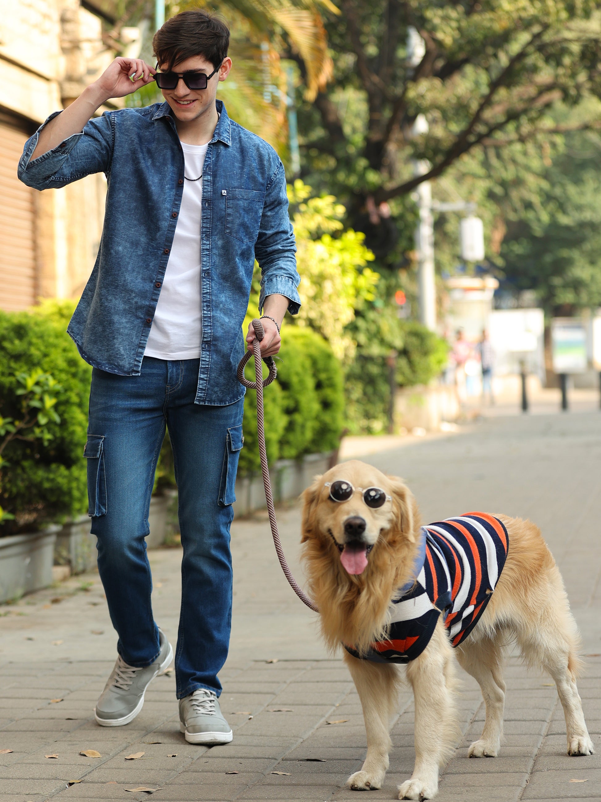 Stylish men wearing faded blue denim shirt with button-down front