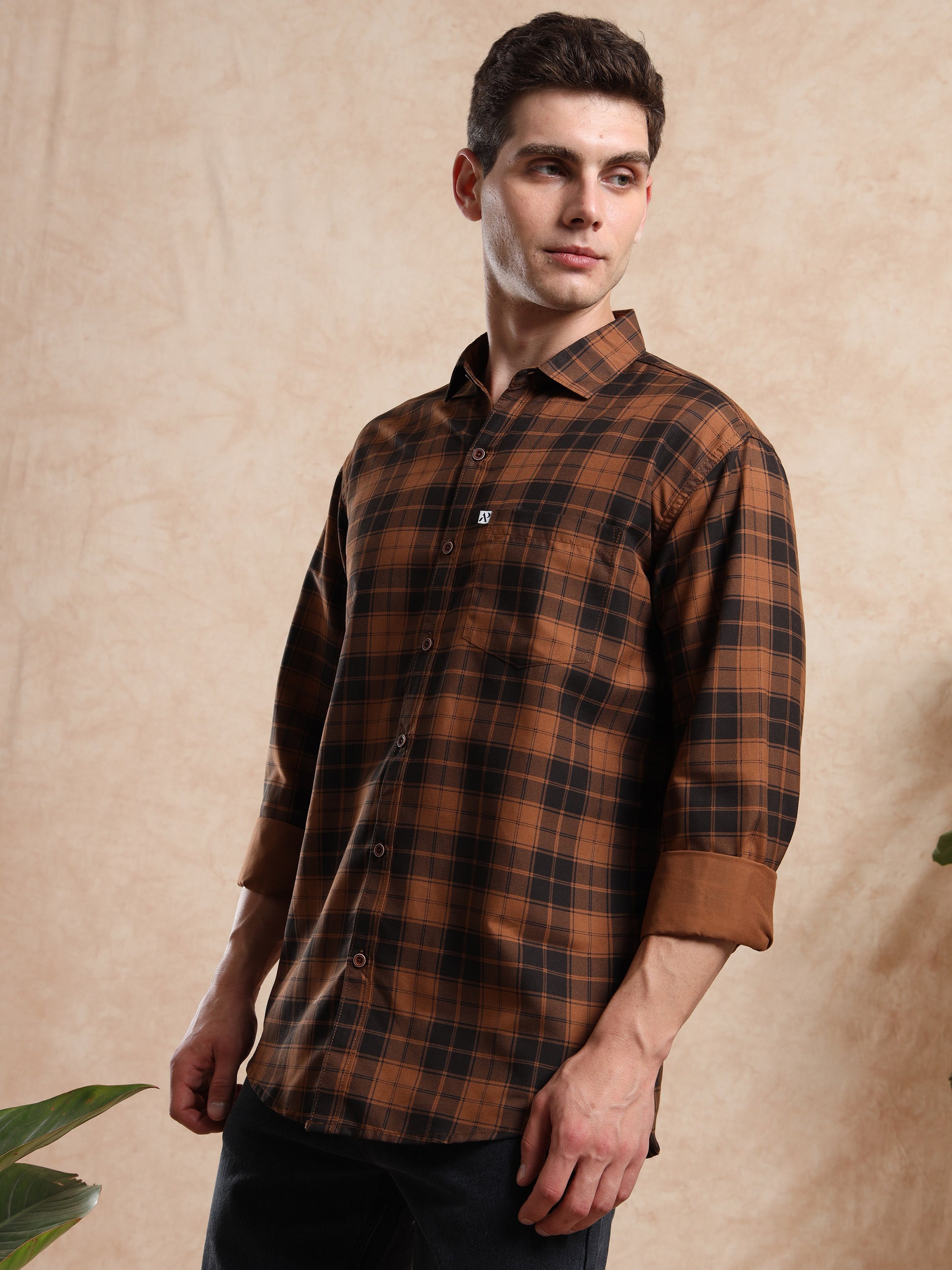 men, brown checked shirt with rolled sleeves and smart casual look