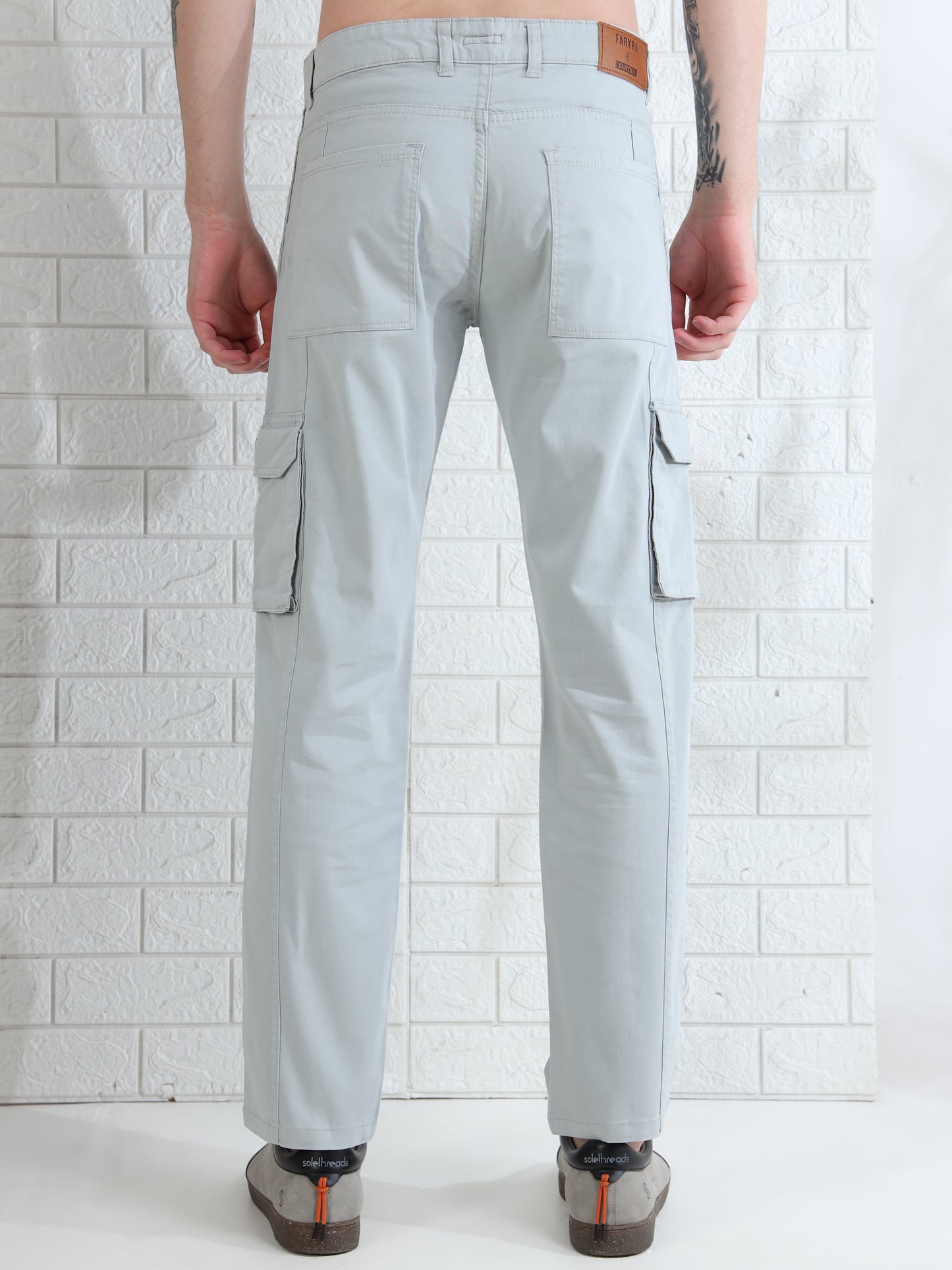 Men's light grey cotton cargo pants with side pockets and slim fit design