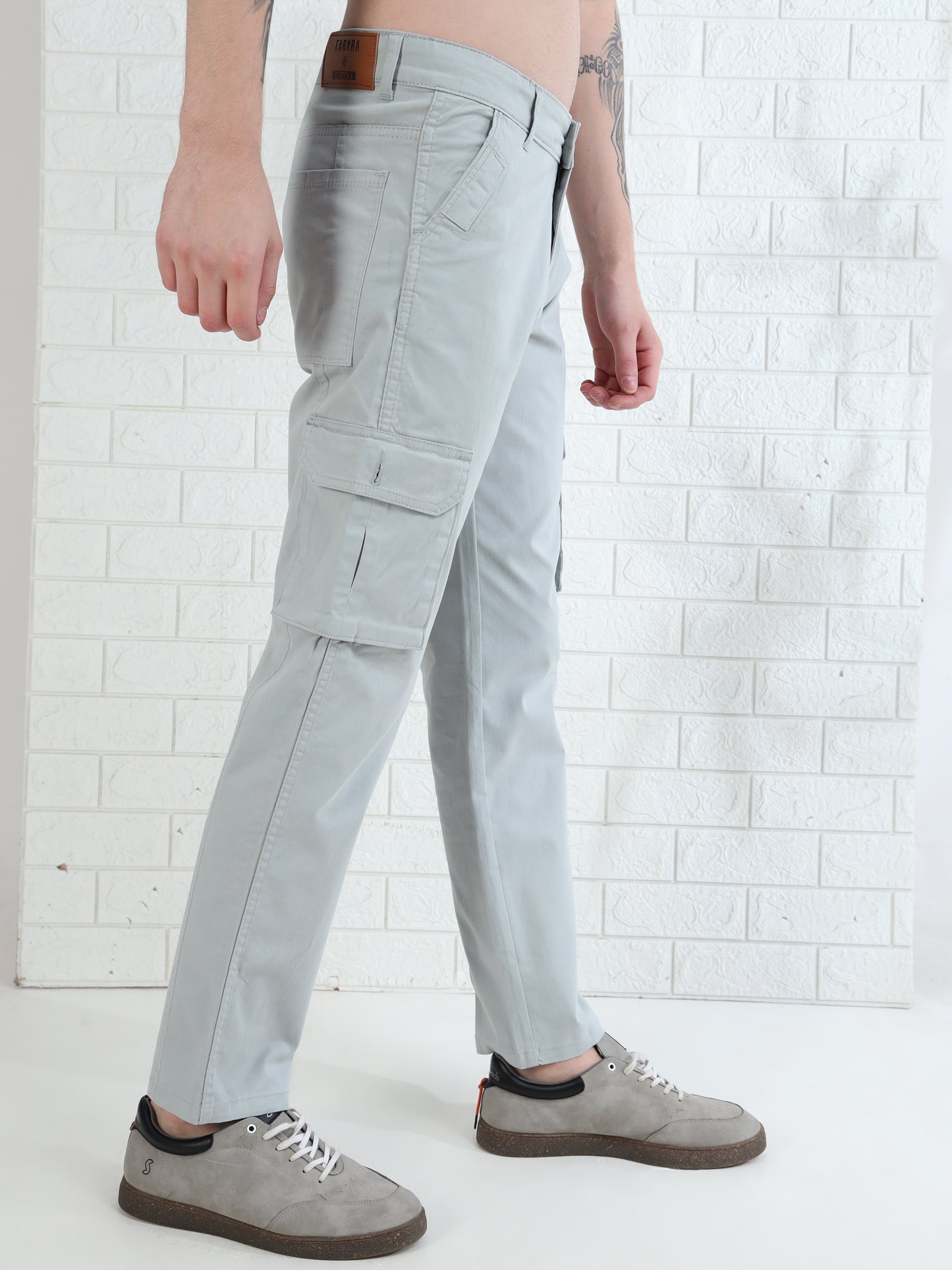 Fashionable men's light grey cargo pants with multiple utility pockets