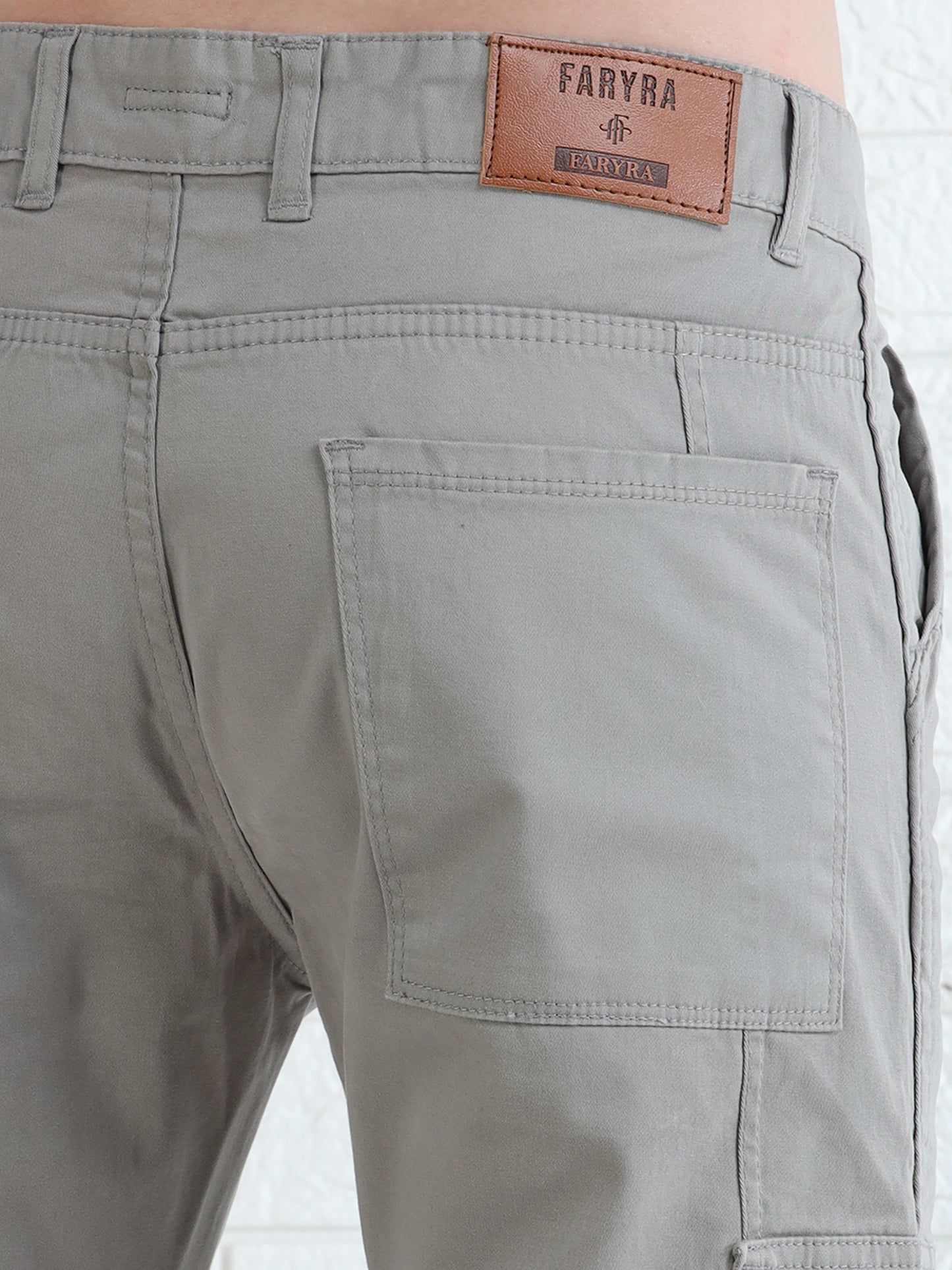 Durable men's utility cargo pants in beige with structured pocket detailing