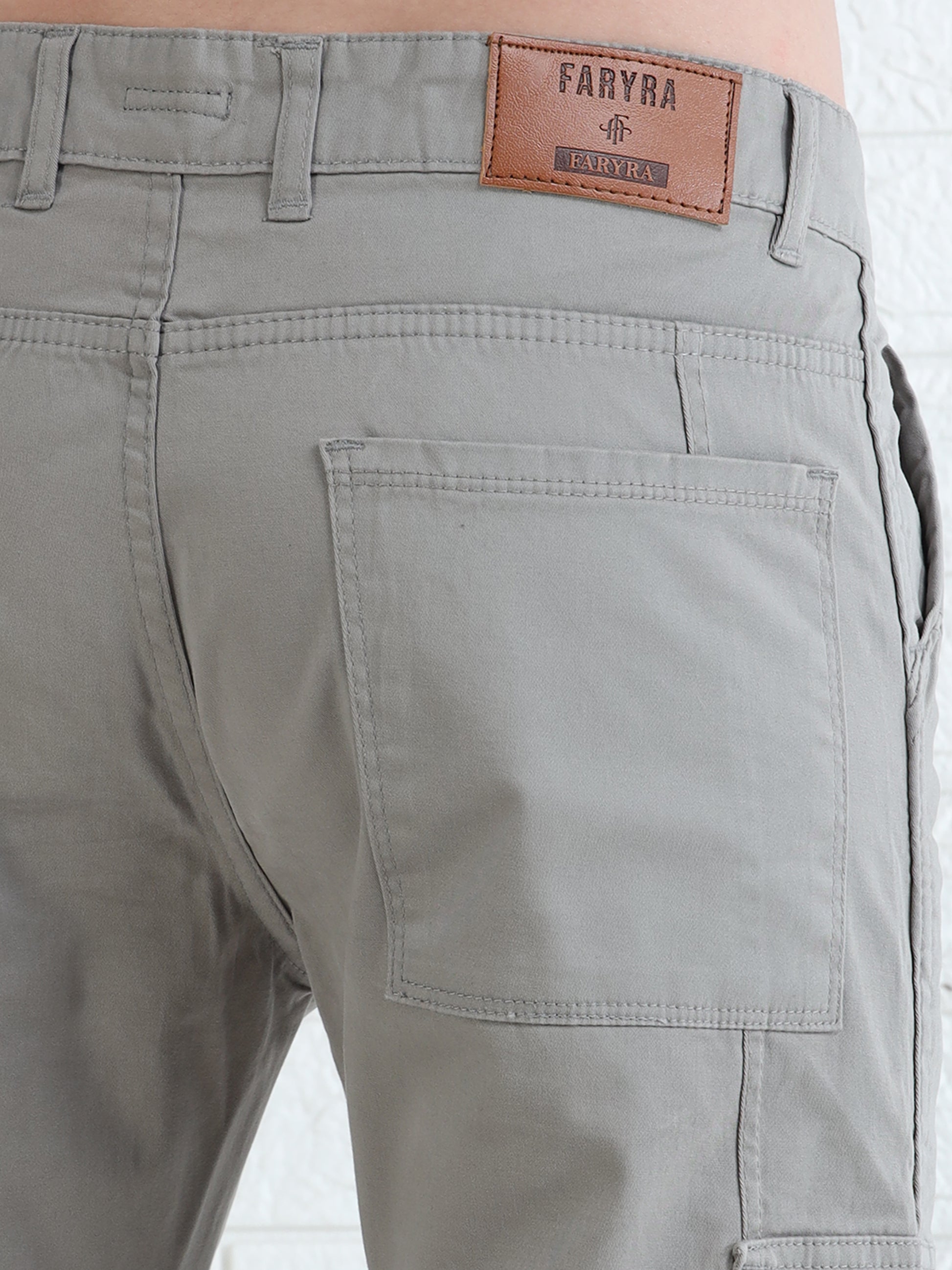 Durable men's utility cargo pants in beige with structured pocket detailing