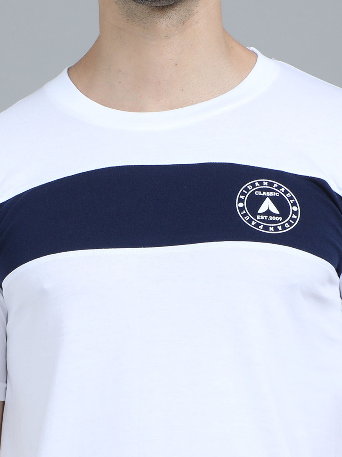 Men's white crew neck t-shirt with navy stripe paired with black jeans smart everyday fashion wear.