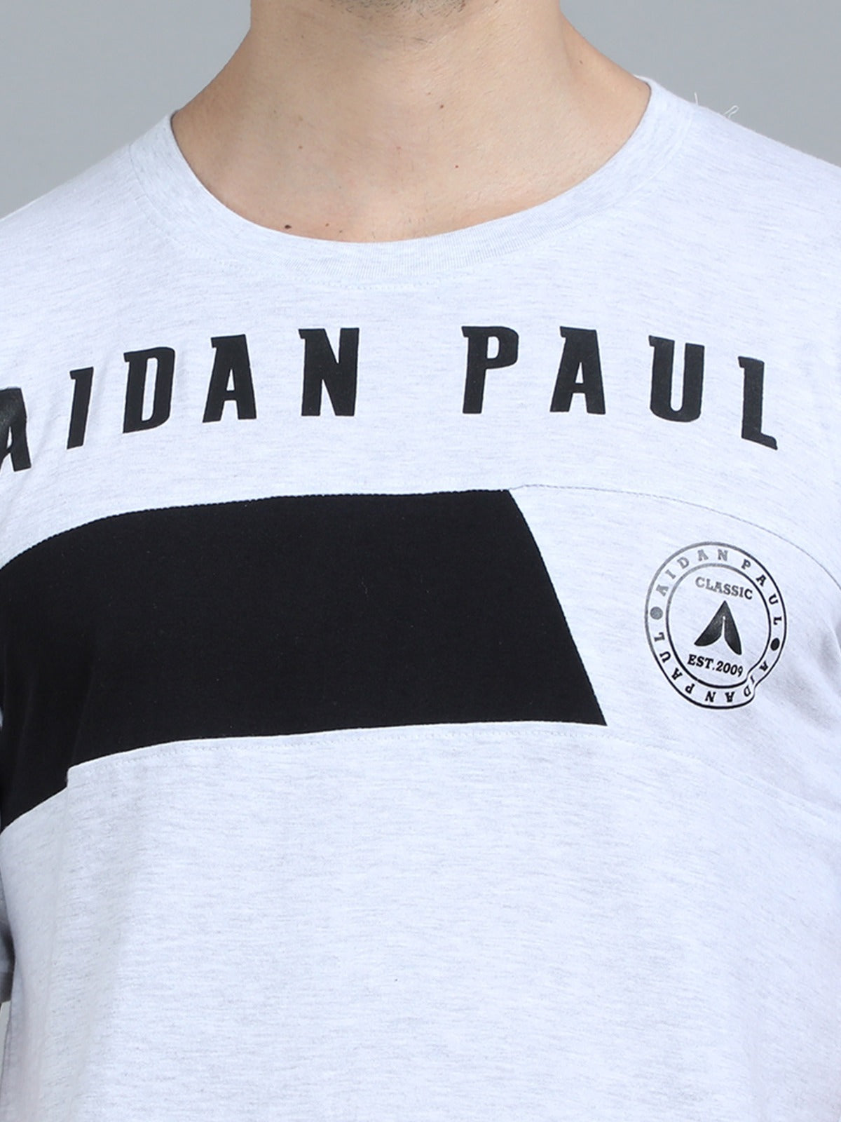 Stylish men's white slim fit t-shirt with printed chest graphic and logo modern casual outfit.