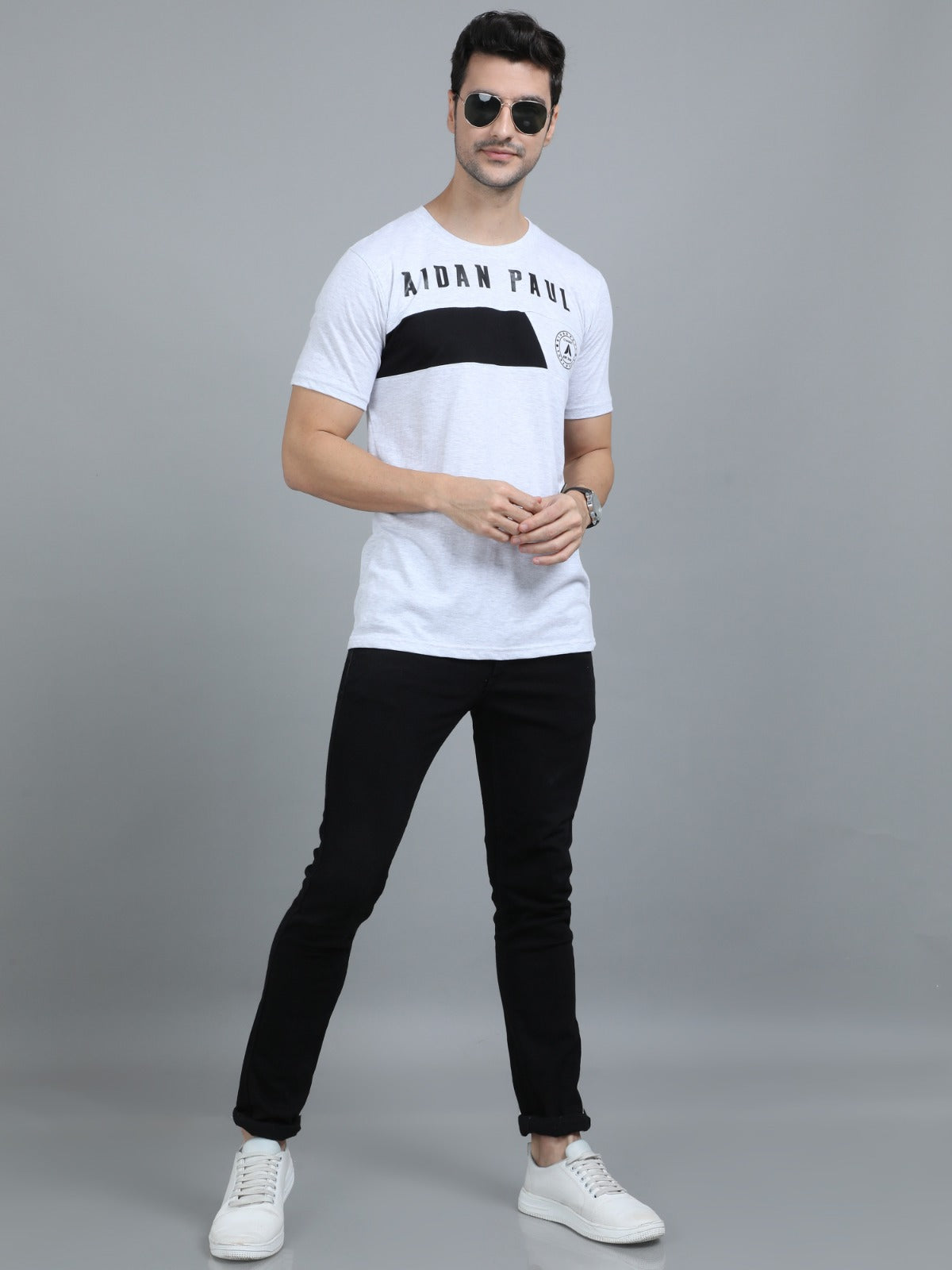 Fashionable men's white printed t-shirt front pose for summer casual streetwear look.