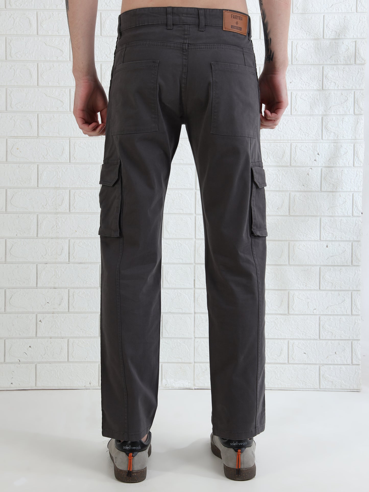 Men's charcoal grey cotton cargo pants with side flap pockets and straight fit