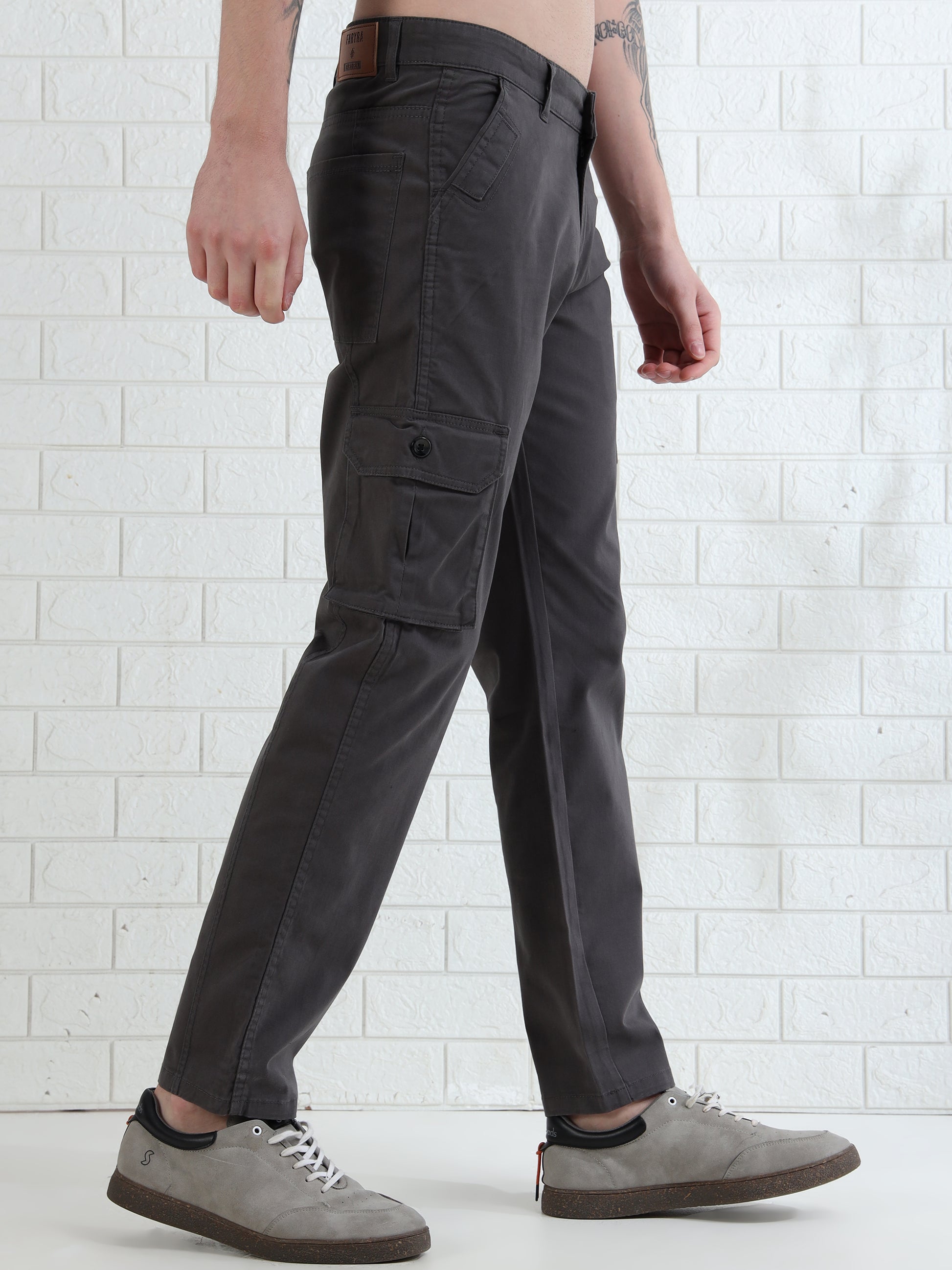 Casual men's grey cargo pants paired with sneakers