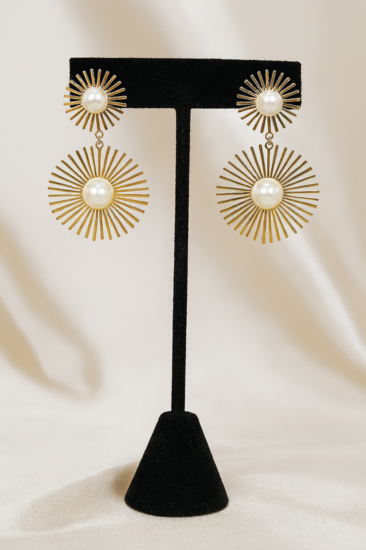 Luxury gold sunburst drop earrings featuring pearl accents