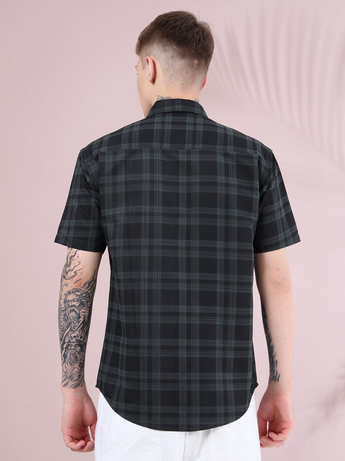 Back view of men, black and green plaid short sleeve shirt