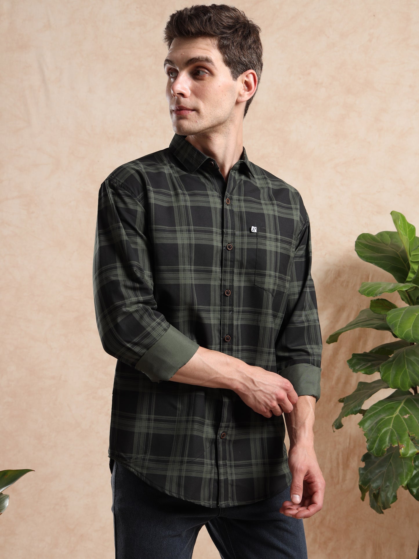 Trendy men, checked shirt in dark green tones