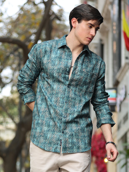 A man wearing a green full sleeve shirt with a digital printed pattern.