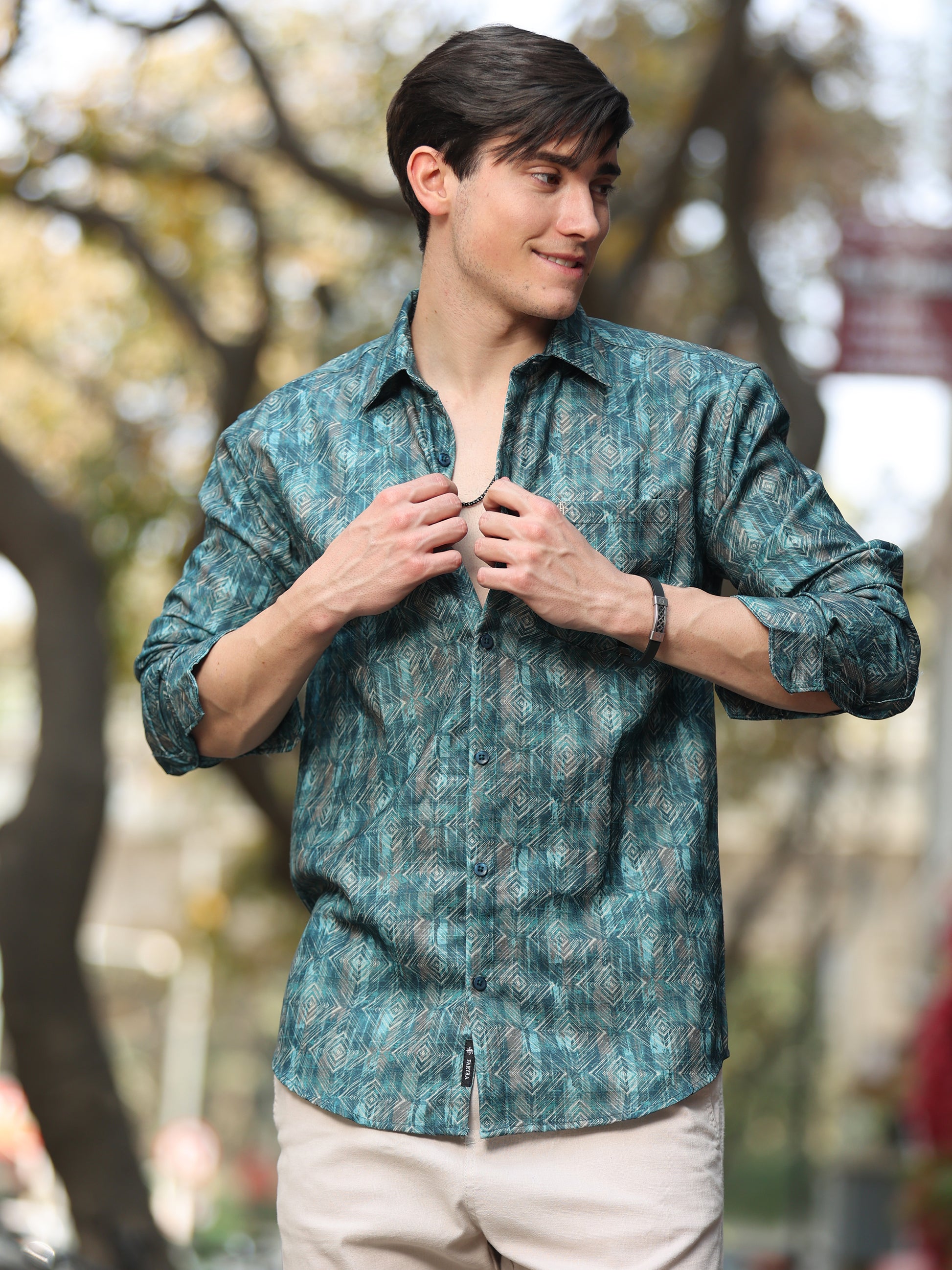 Men's teal green geometric printed shirt with full sleeves and modern pattern