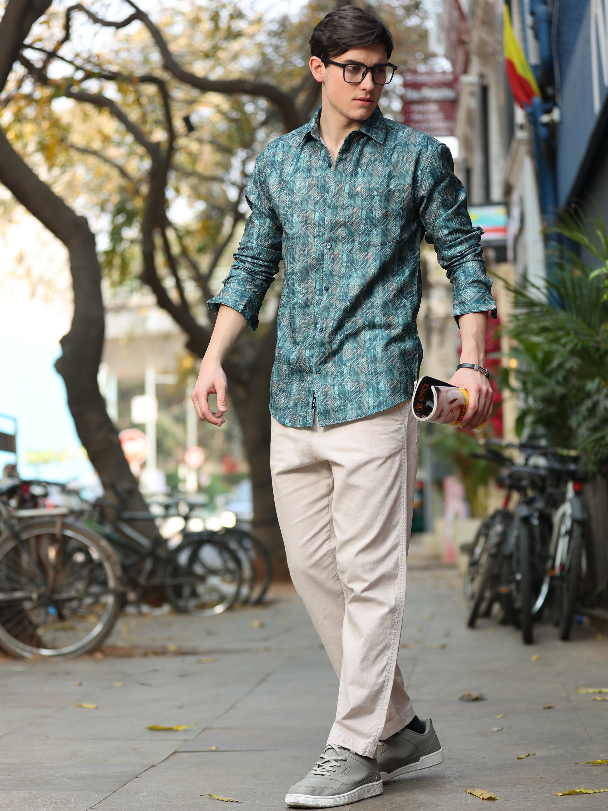 Trendy men's teal printed shirt with abstract geometric design and slim fit
