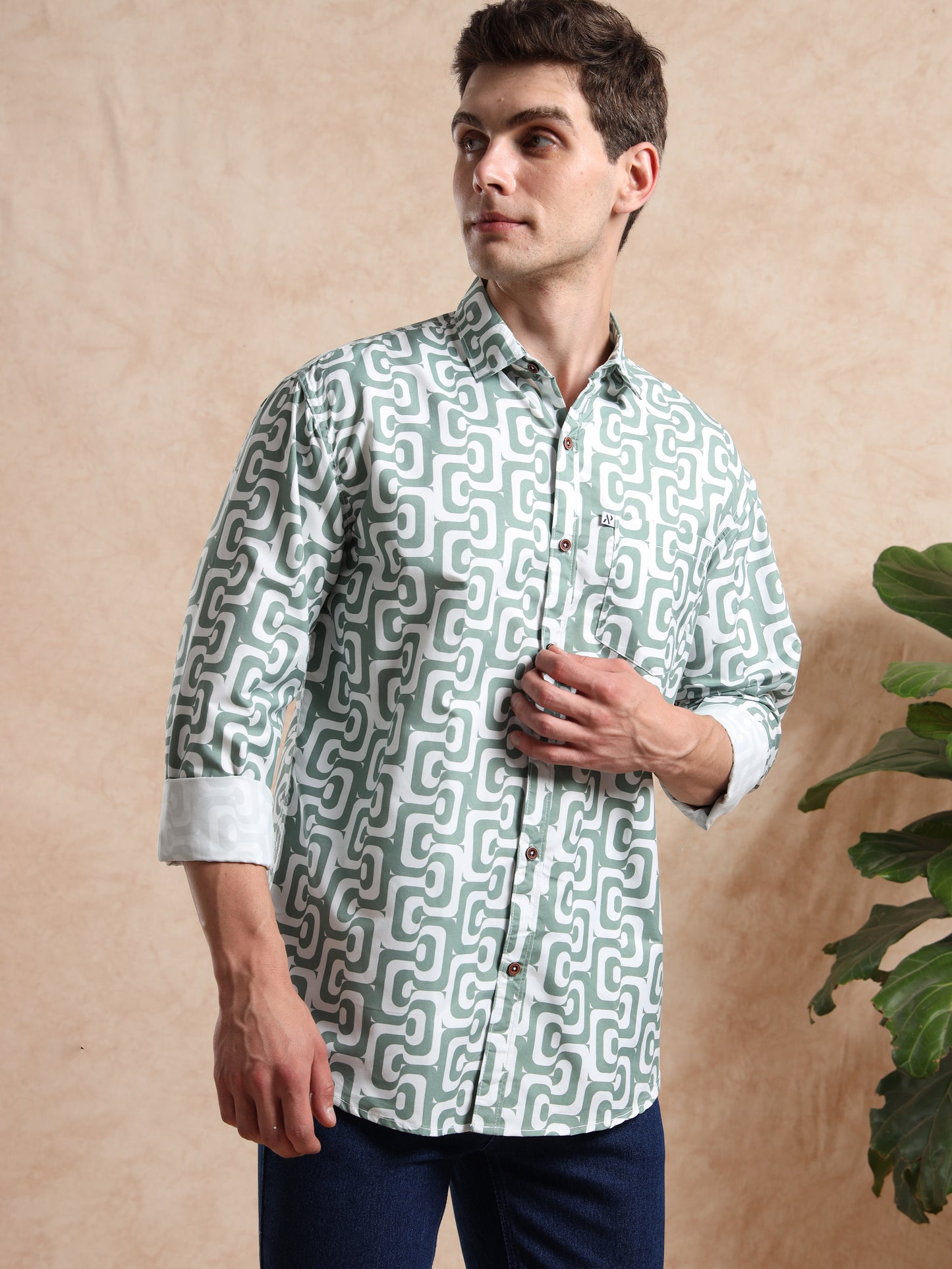 Model in trendy geometric pattern shirt with folded cuffs