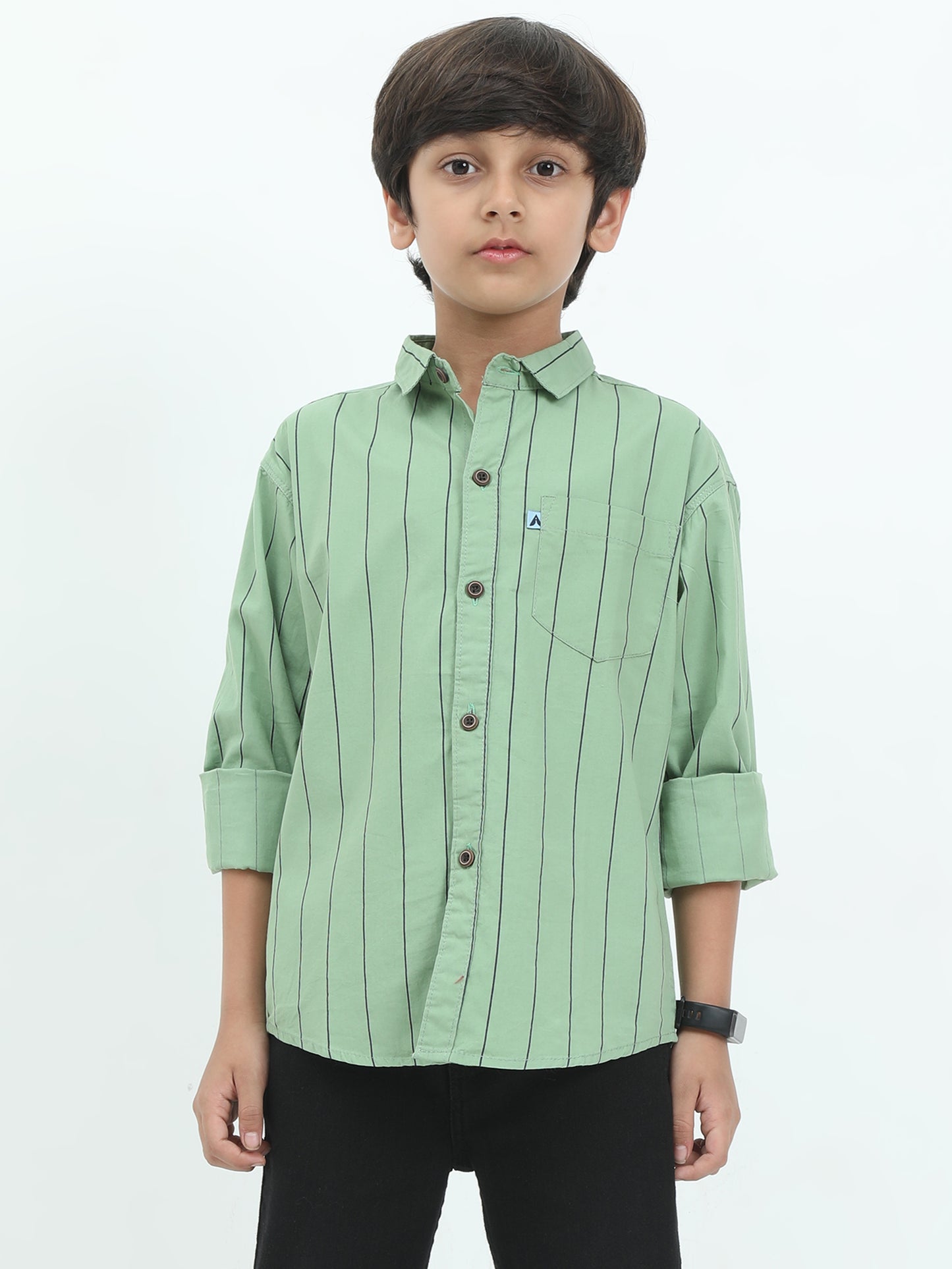 Child wearing a green striped shirt on a white background