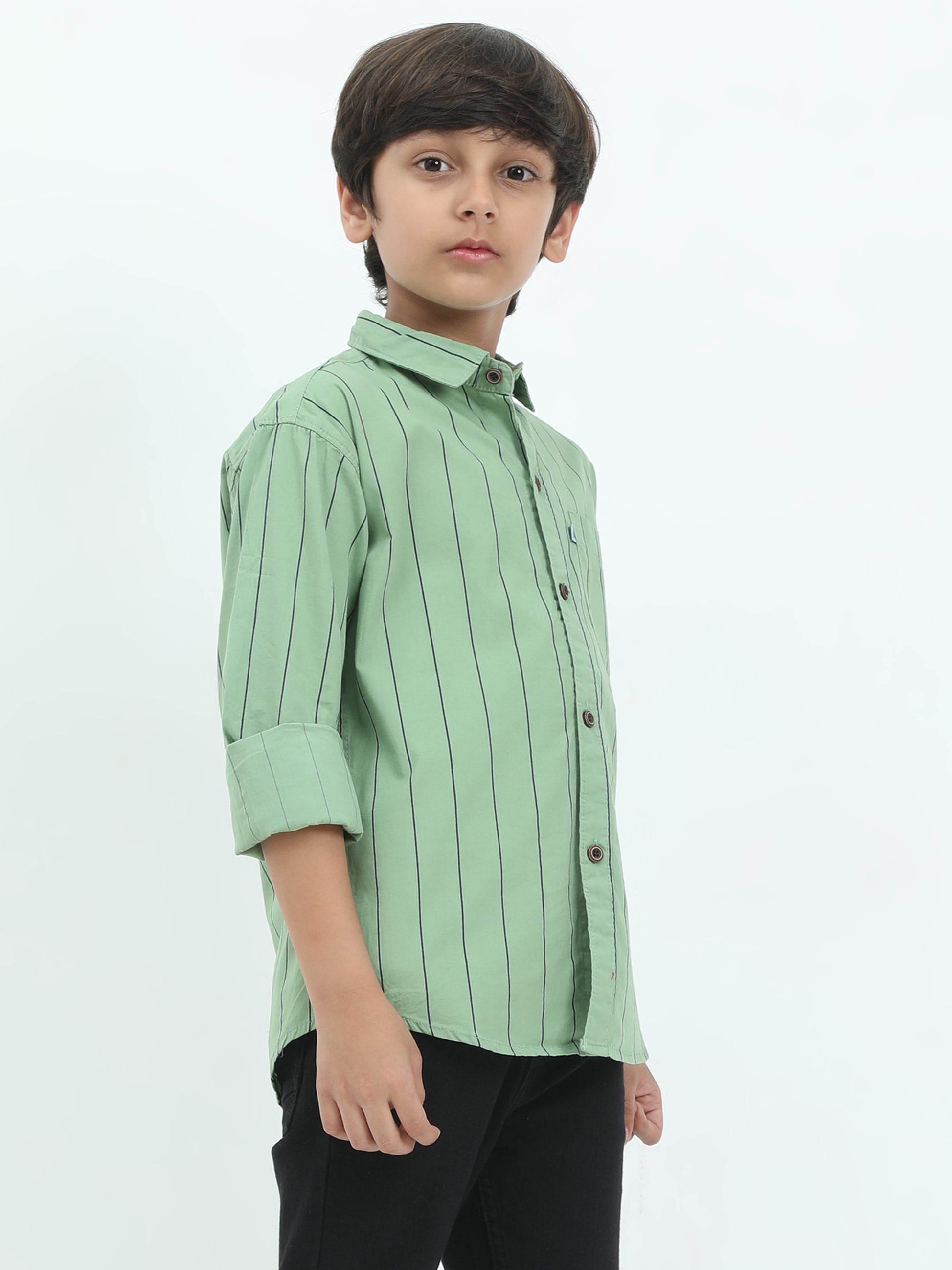 Child wearing a light green striped shirt on a white background