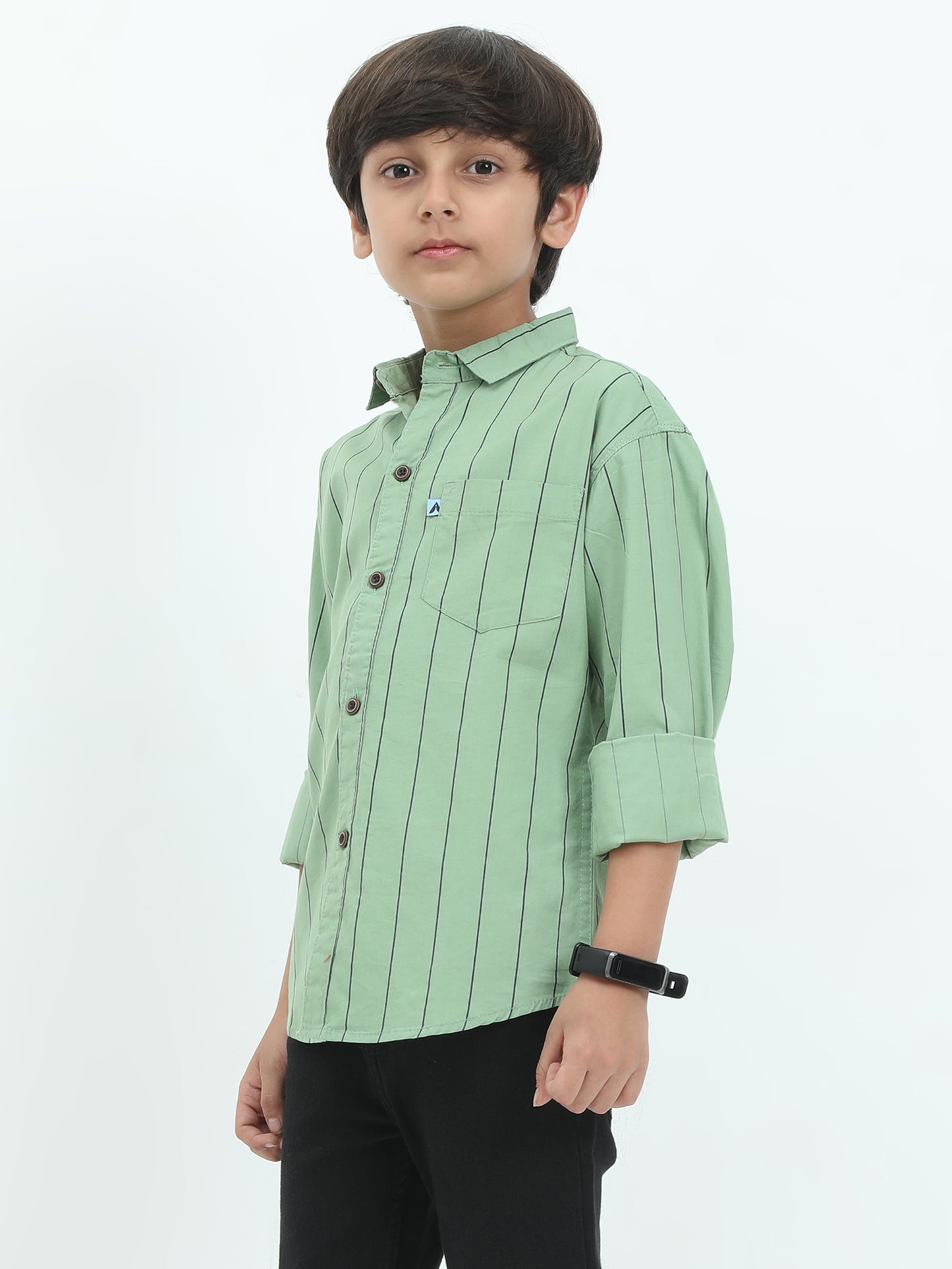 Child wearing a green striped shirt on a white background