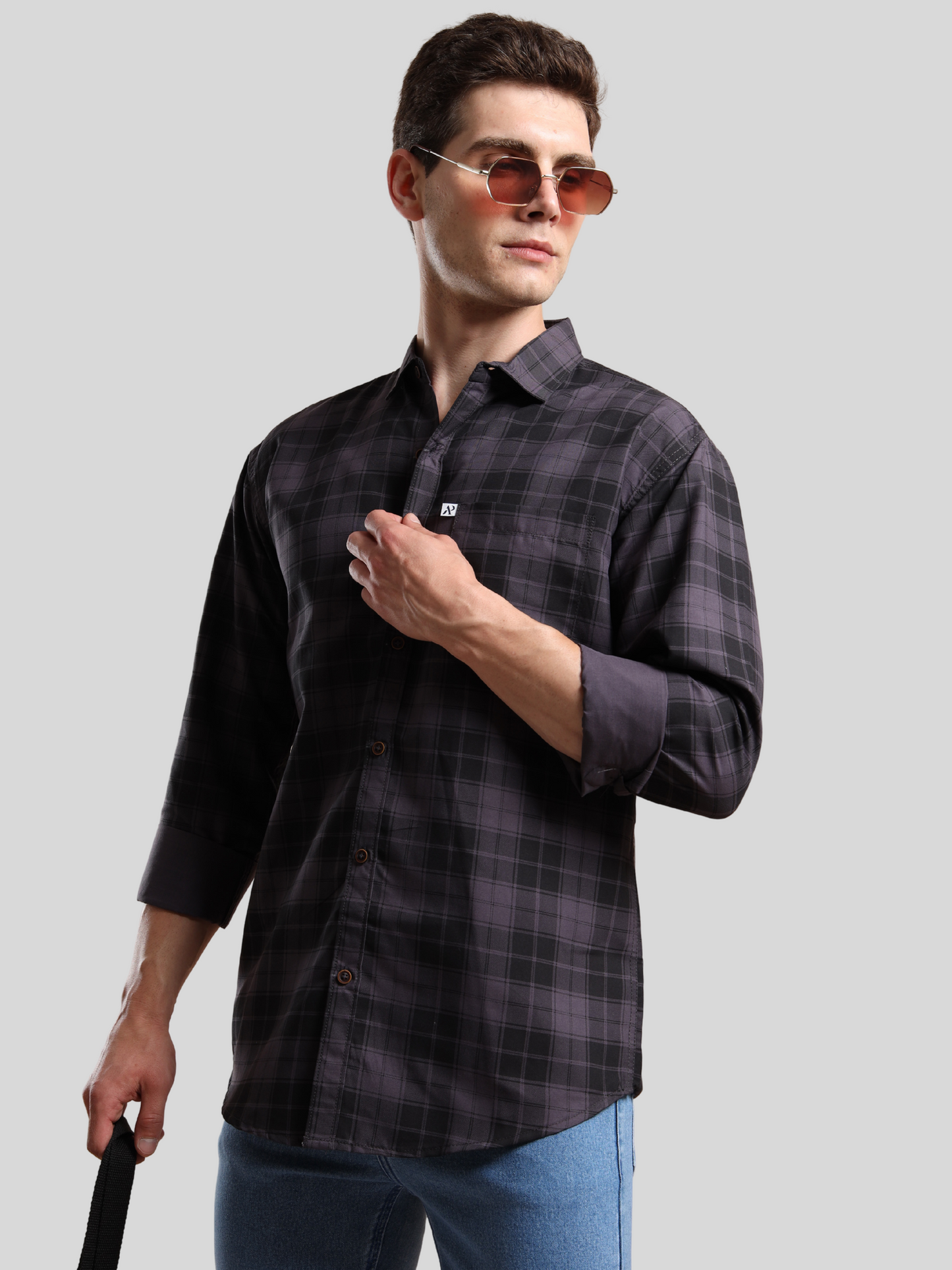 Model wearing black checks shirt with long sleeves casual look