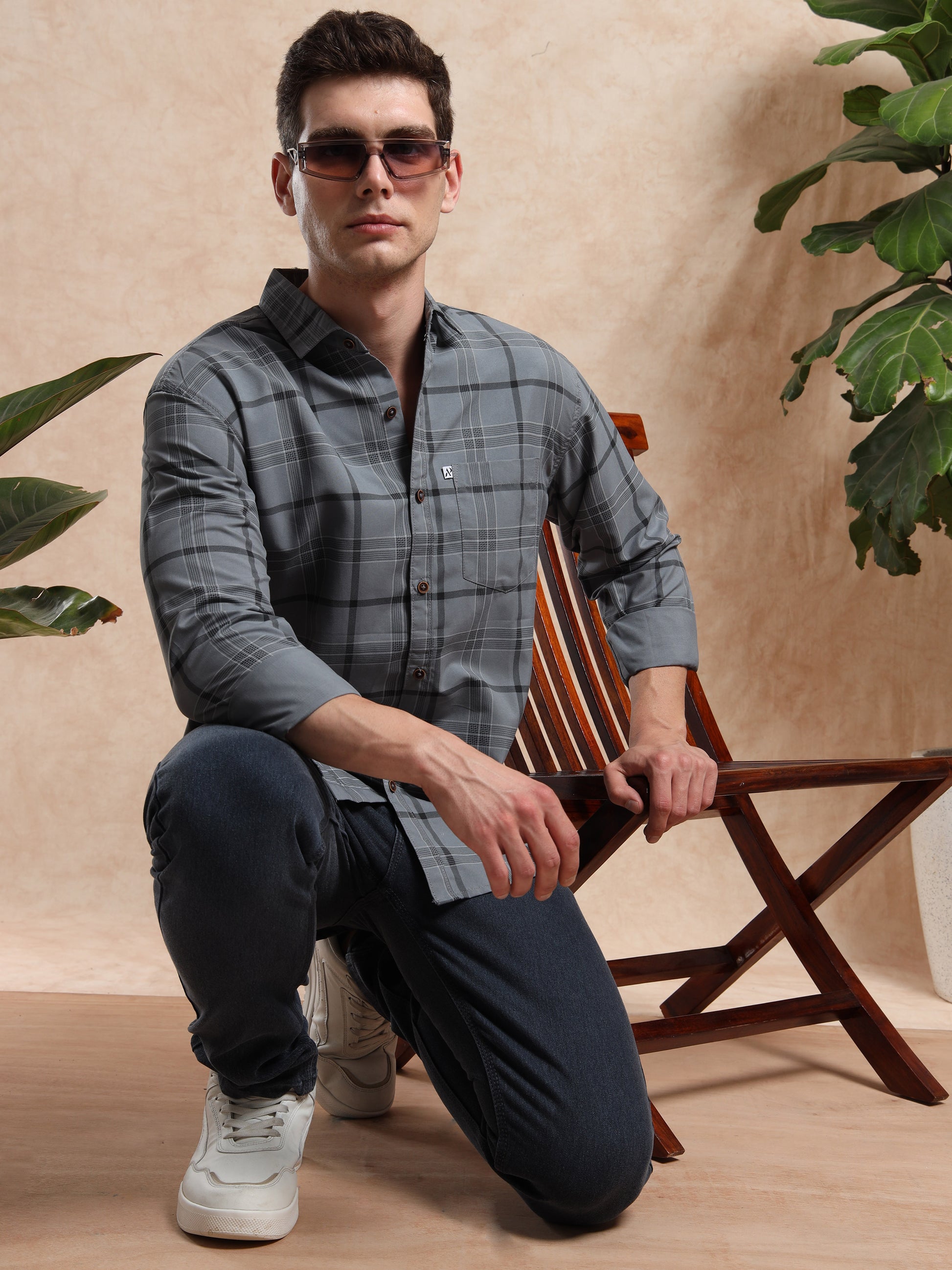 grey checked shirt for men with button closure and chest pocket.