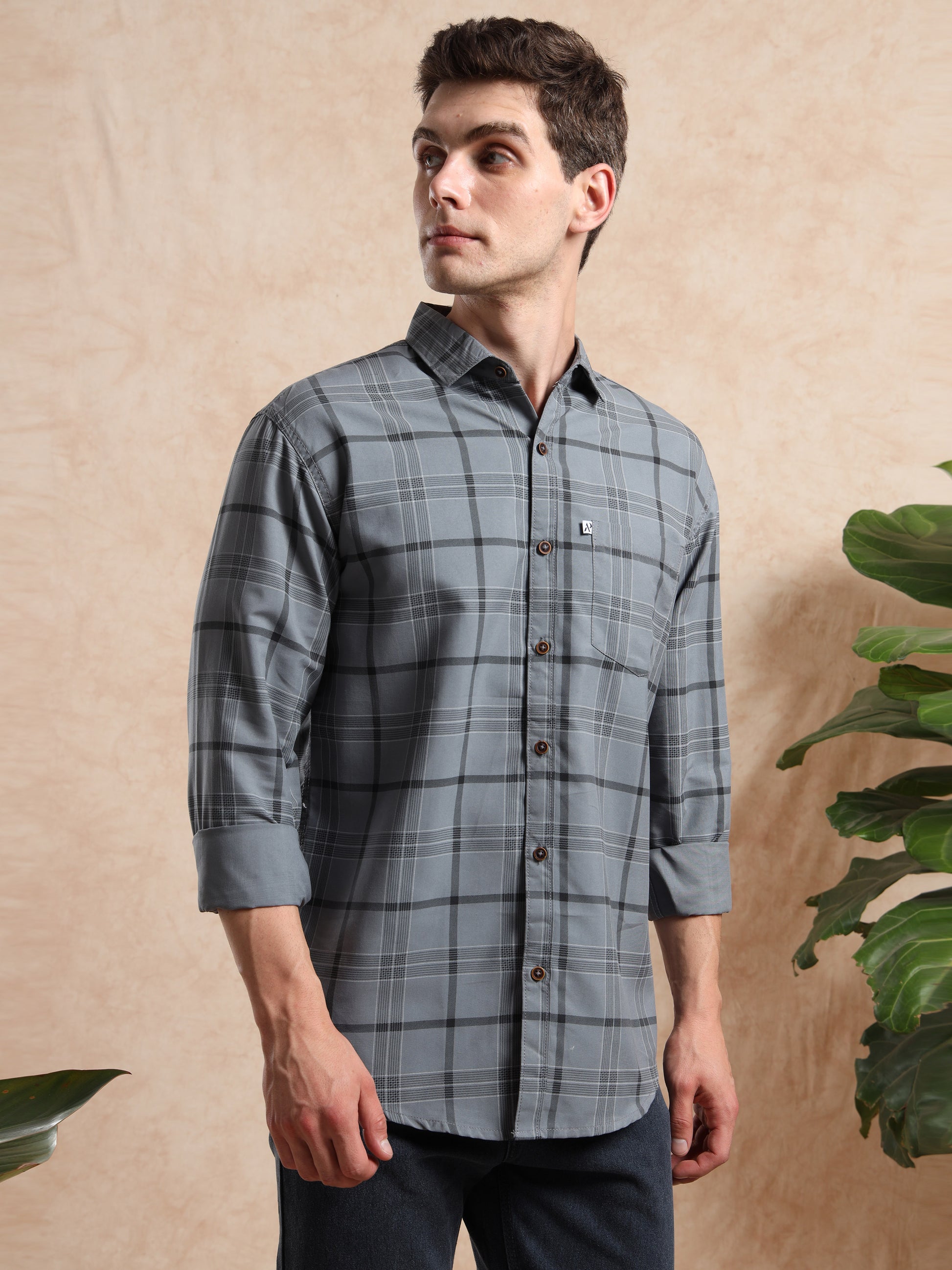grey check shirt showing full sleeves and buttoned front