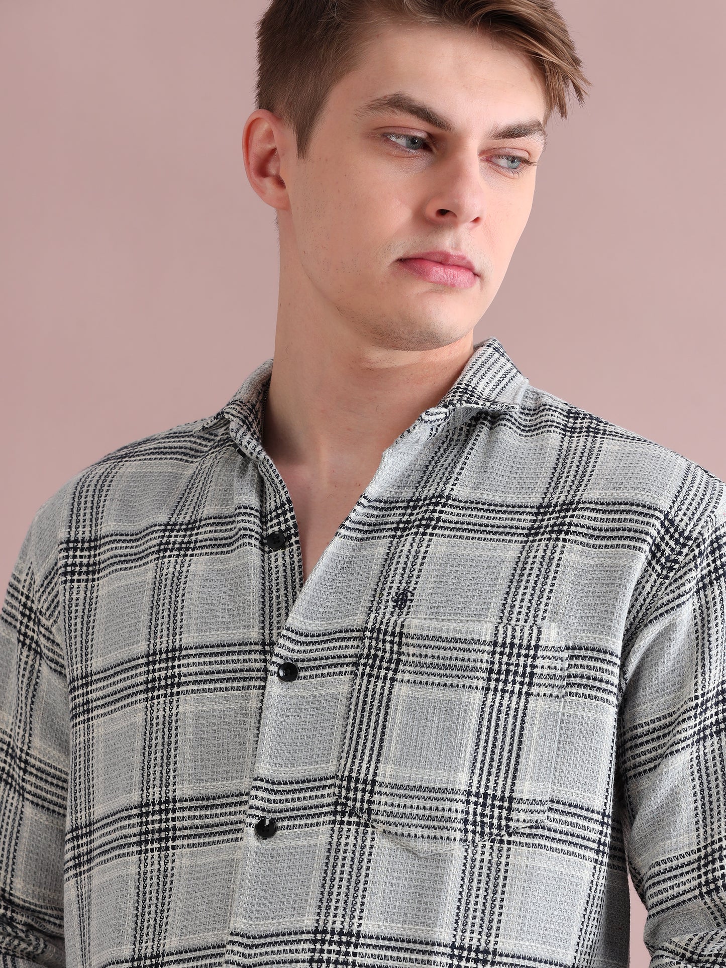 Stylish man wearing grey checkered casual shirt with button-down front