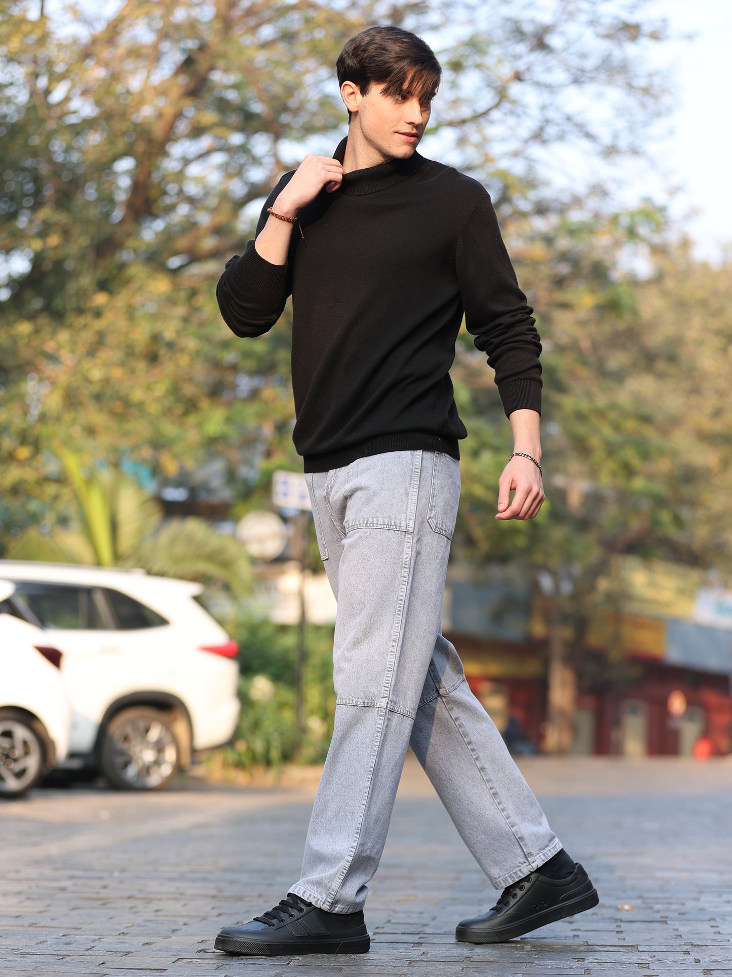 Stylish men's grey jeans with relaxed fit and faded wash finish