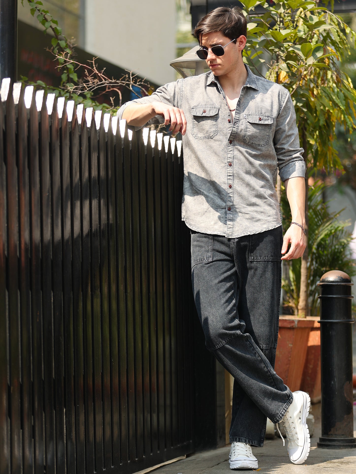 Stylish men wearing light grey faded denim shirt with button-down front