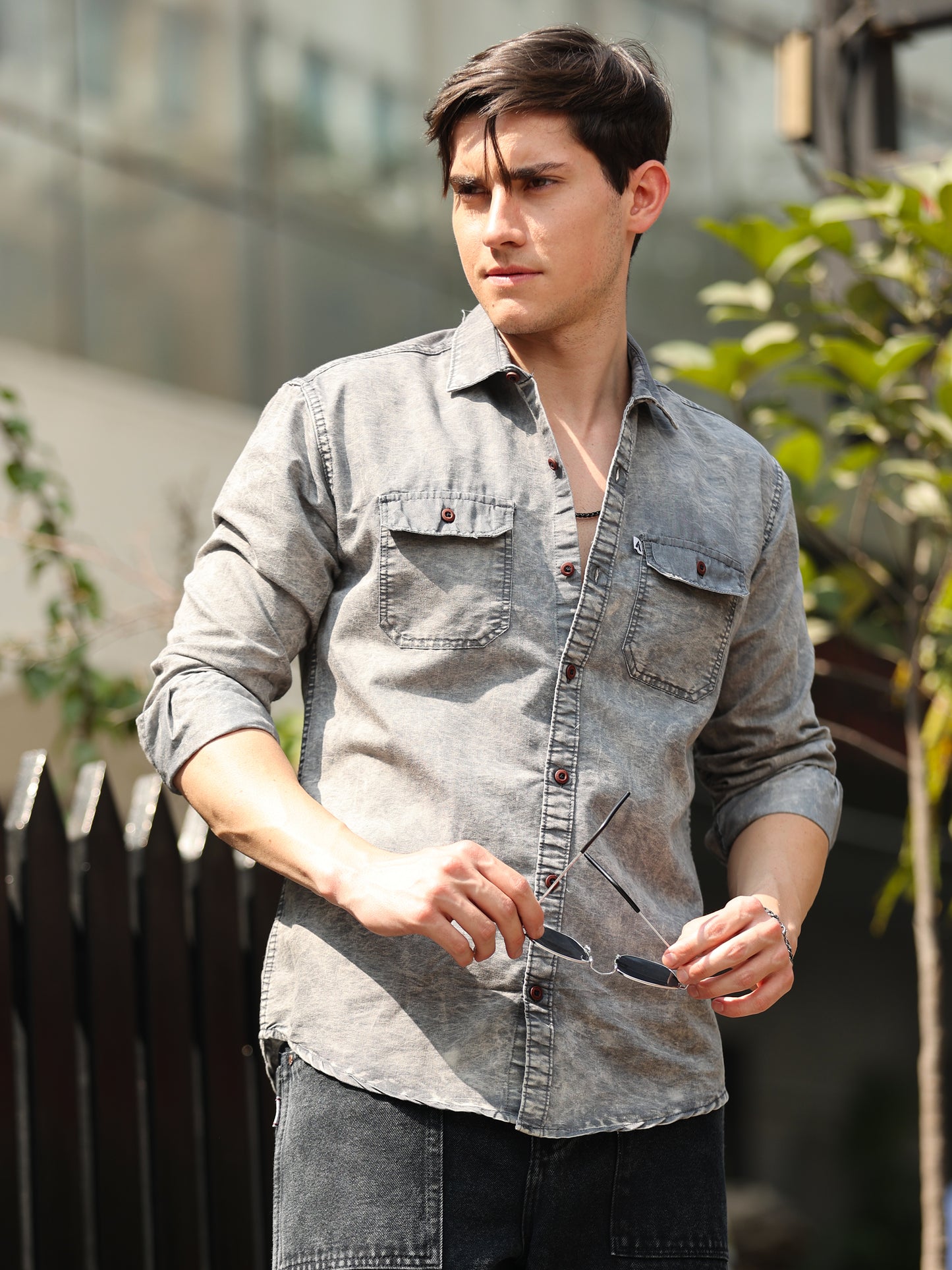 grey denim shirt for men paired with black pants