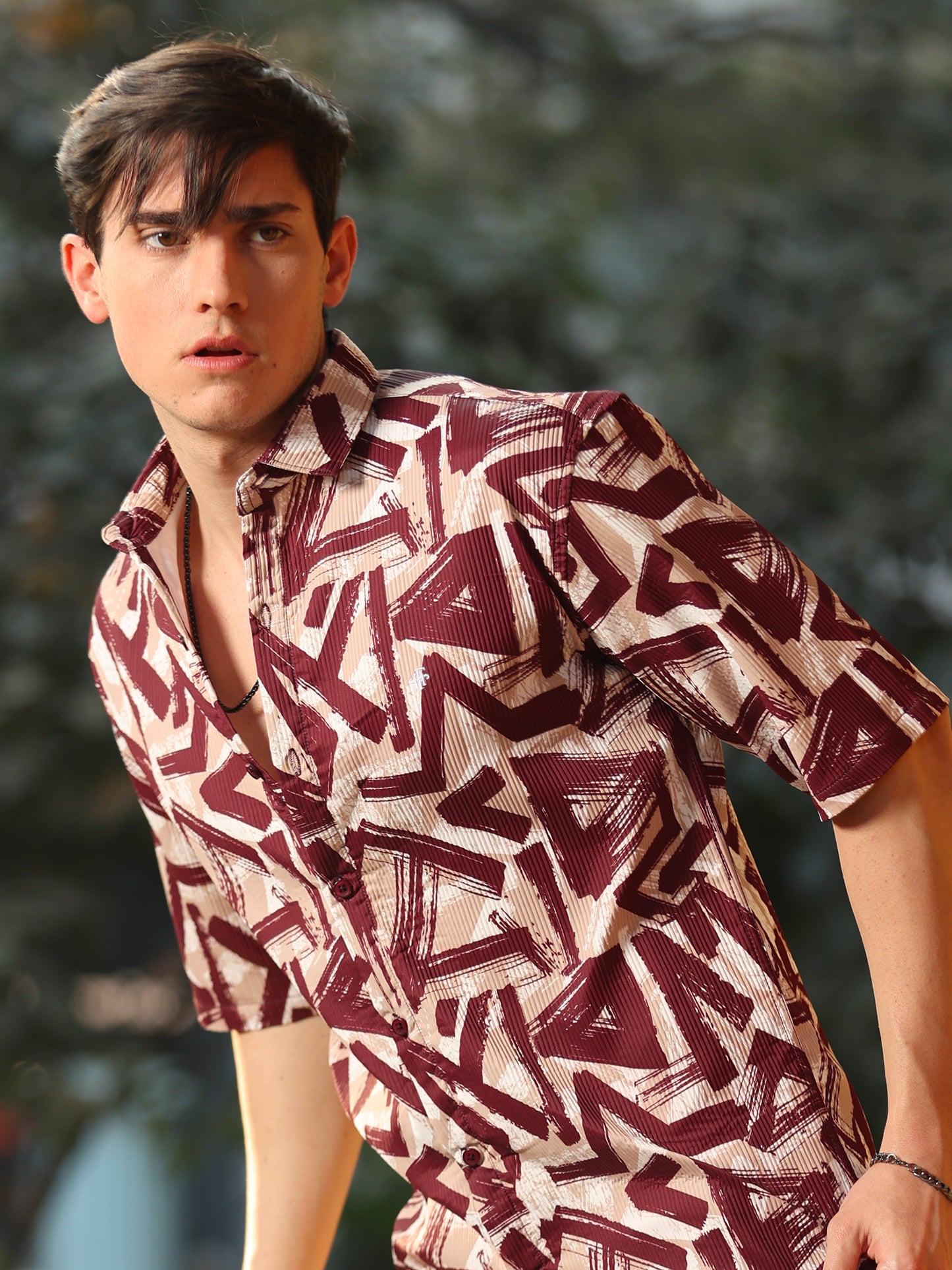 Fashionable men's maroon graphic print shirt with contemporary style