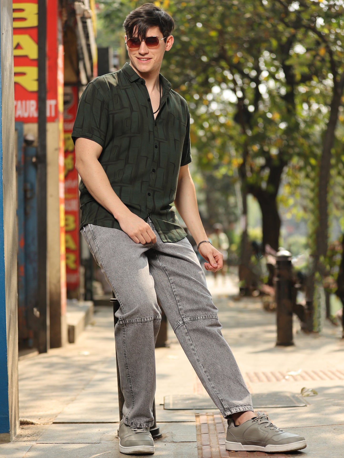 Fashionable men's olive green shirt with unique abstract print and relaxed fit