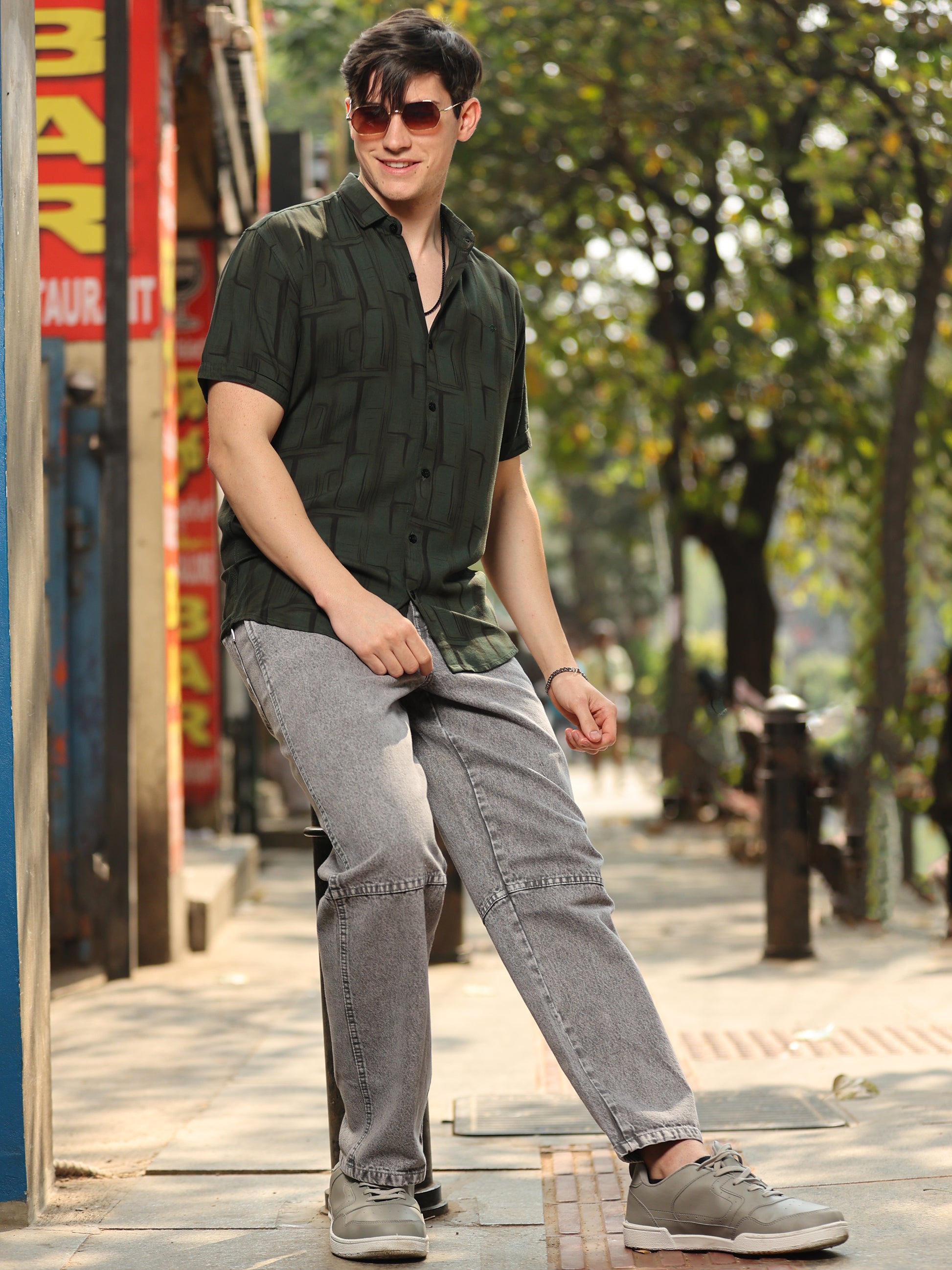 Fashionable men's olive green shirt with unique abstract print and relaxed fit