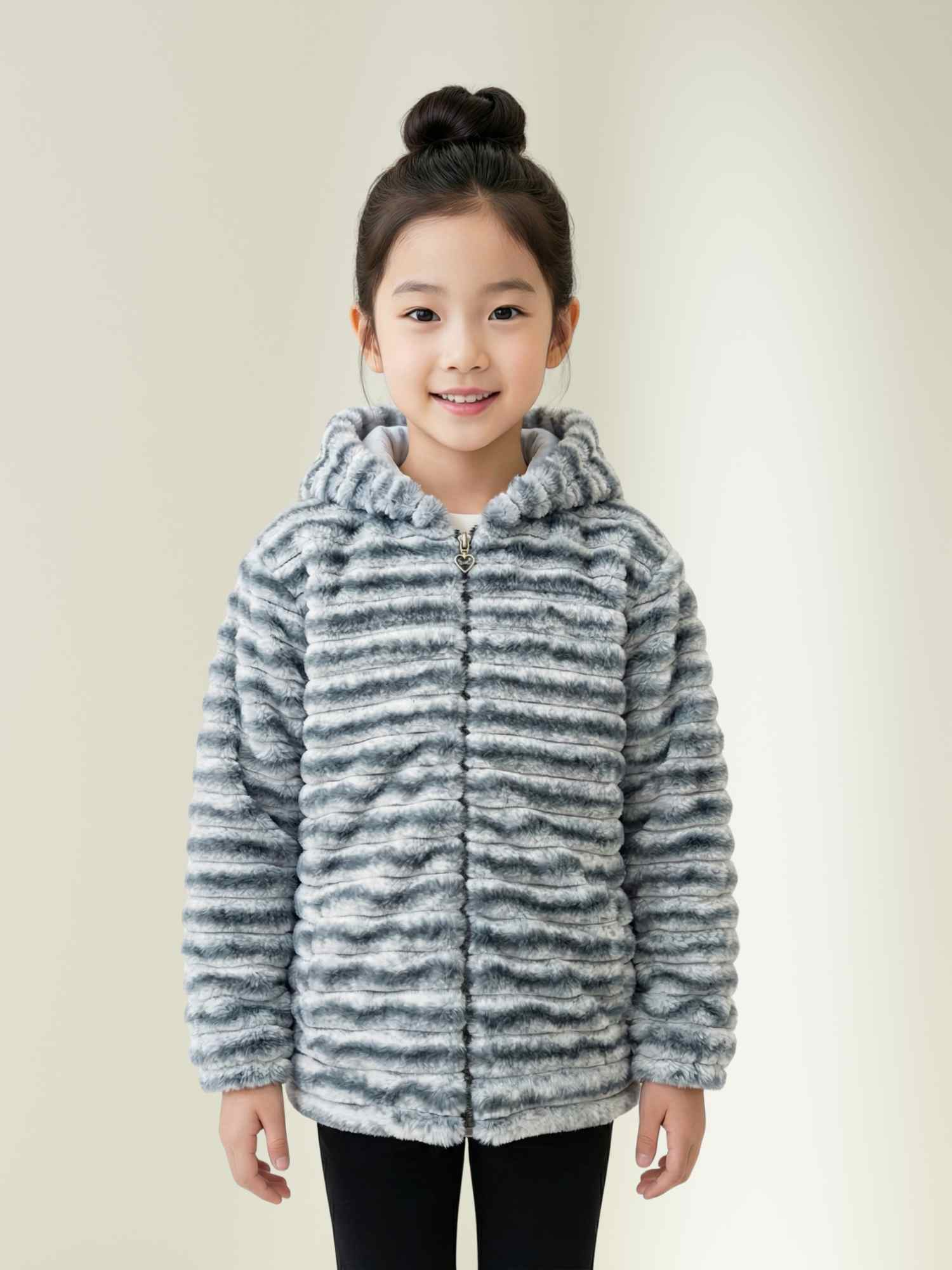 grey faux fur hooded winter jacket with zipper open and hands in pockets, kids cozy winter wear.