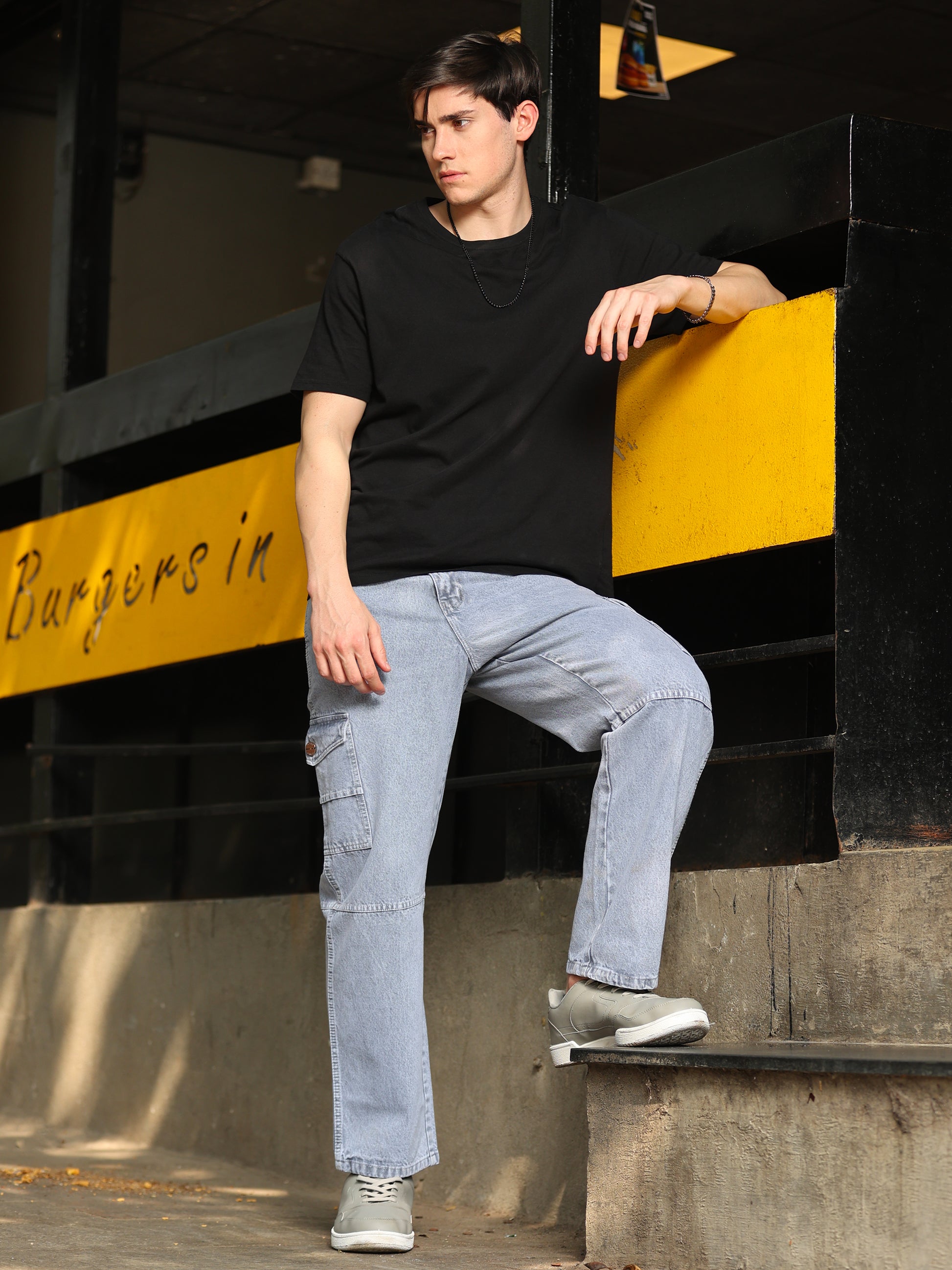 Stylish men's grey jeans with relaxed fit and faded wash finish