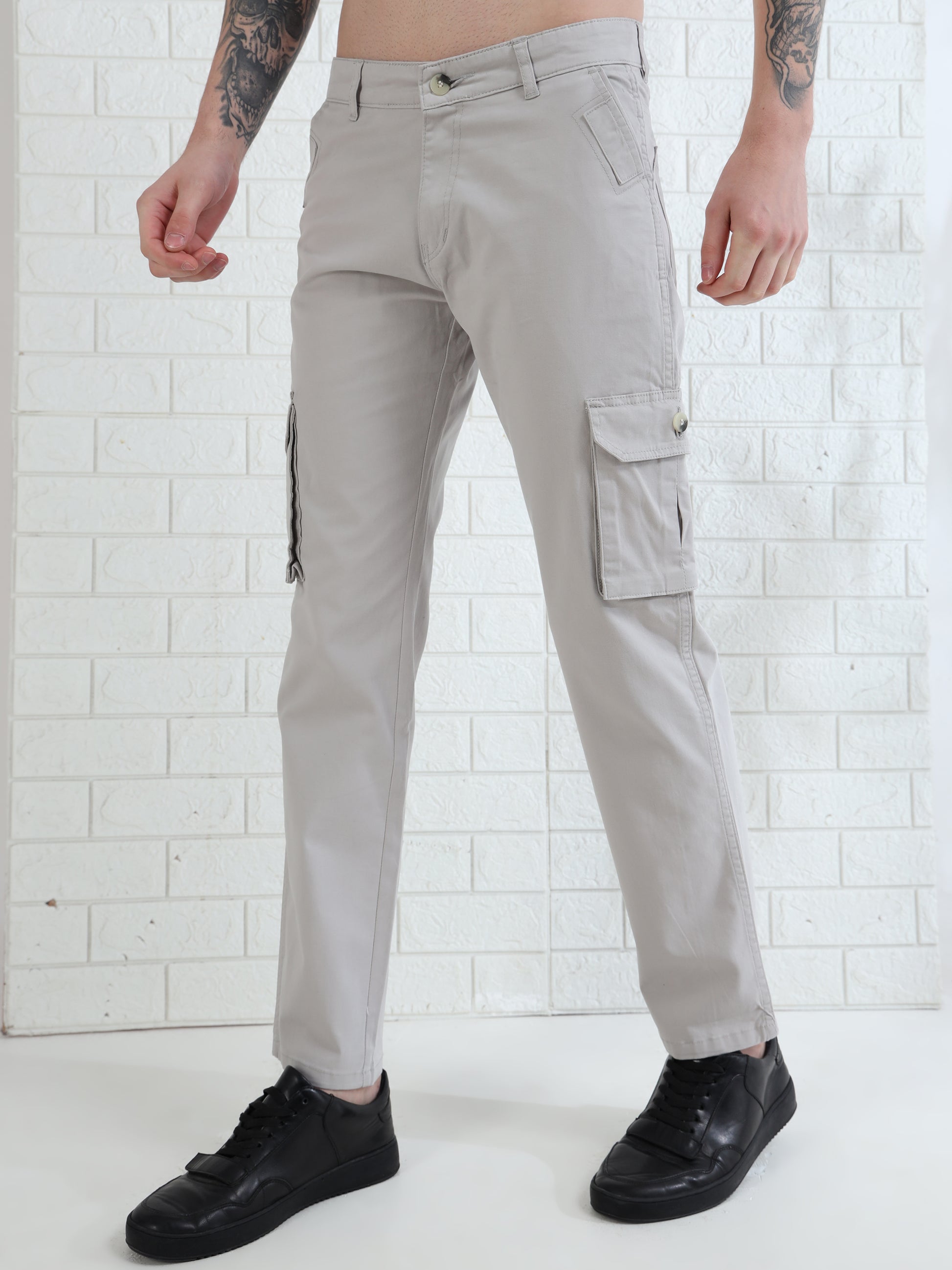 Stylish men's grey cargo trousers with utility pockets and modern slim look