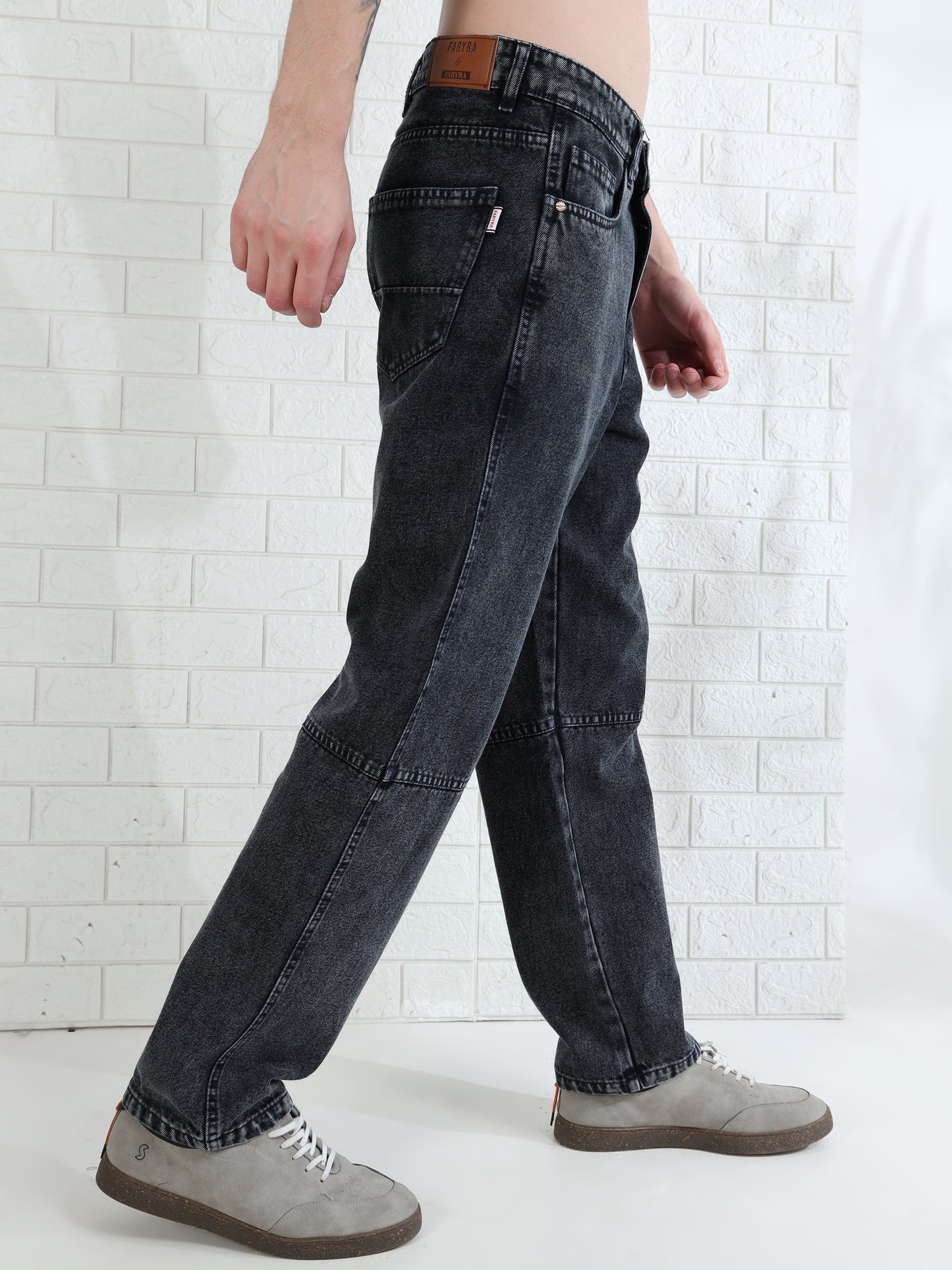 Fashionable men's straight leg jeans with subtle fade and durable fabric