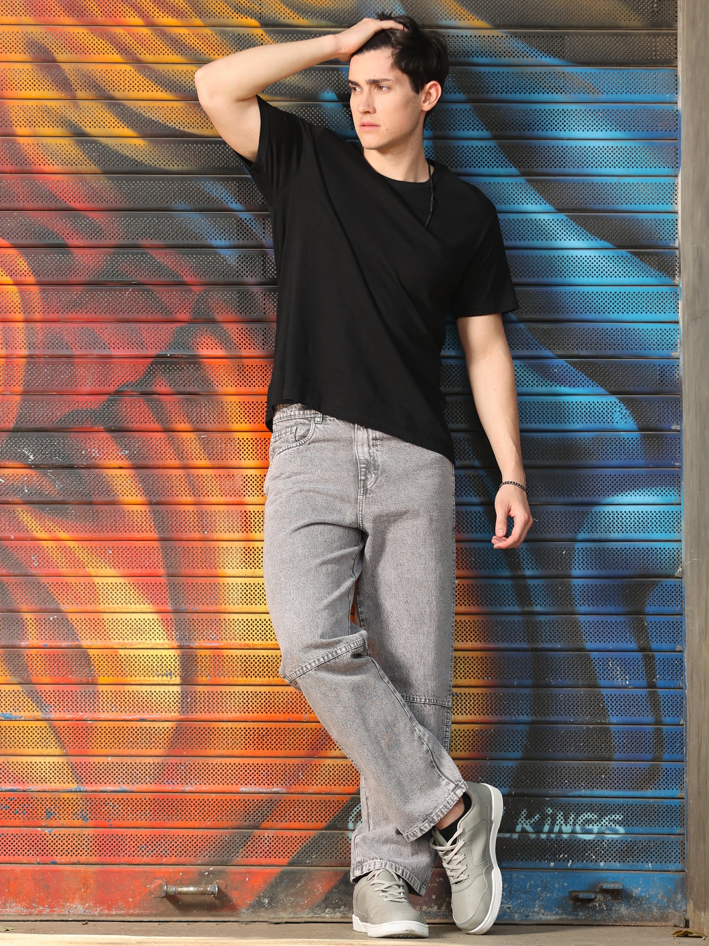 Stylish men's grey jeans with relaxed fit and faded wash finish